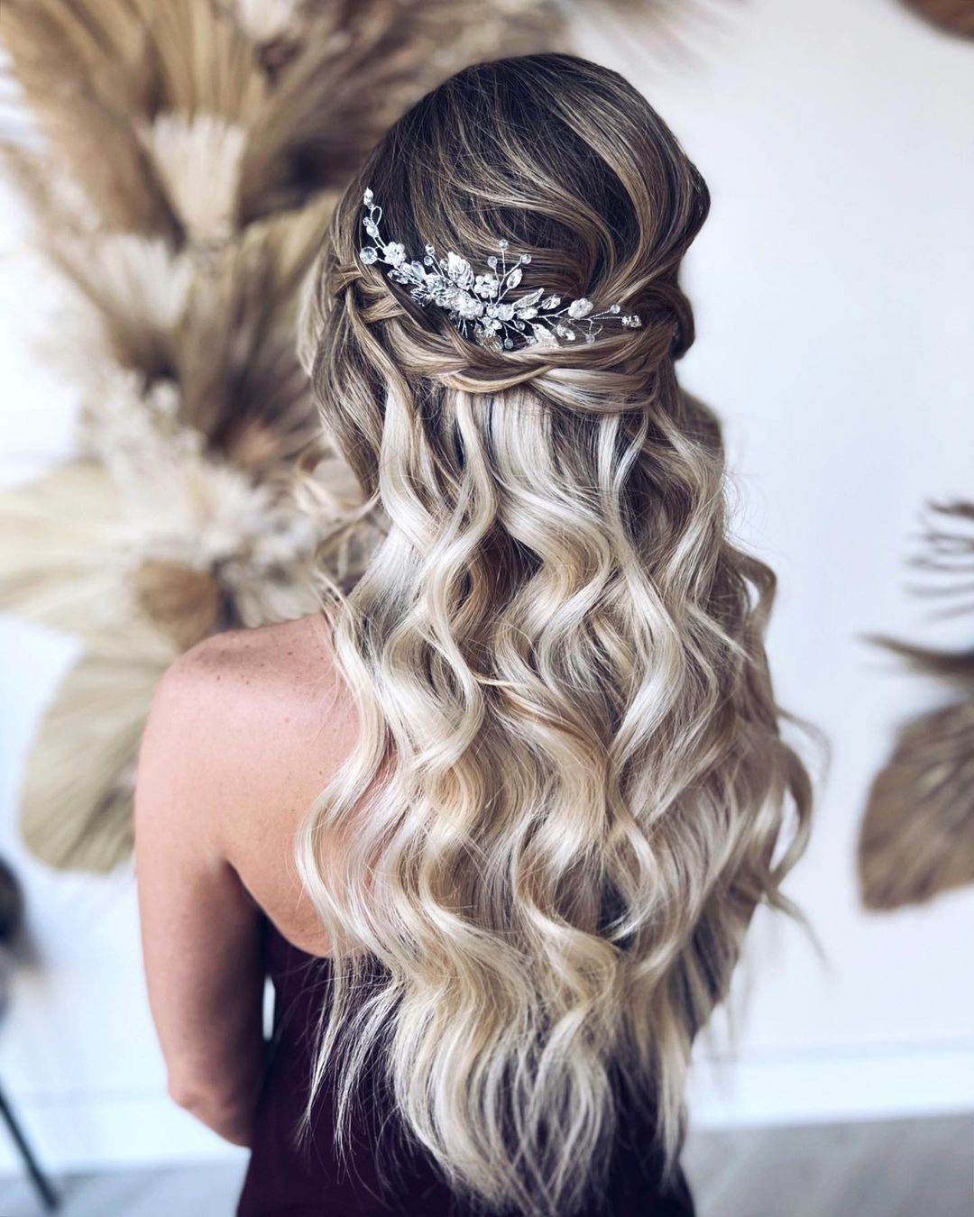 voluminous half up half down wedding hairstyle with waves 