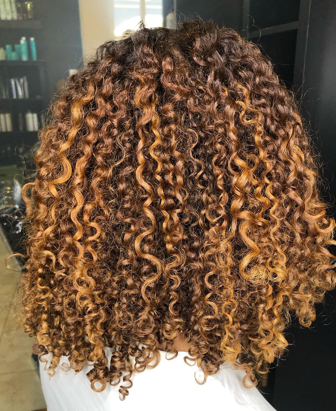 blonde highlights on naturally curly black hair