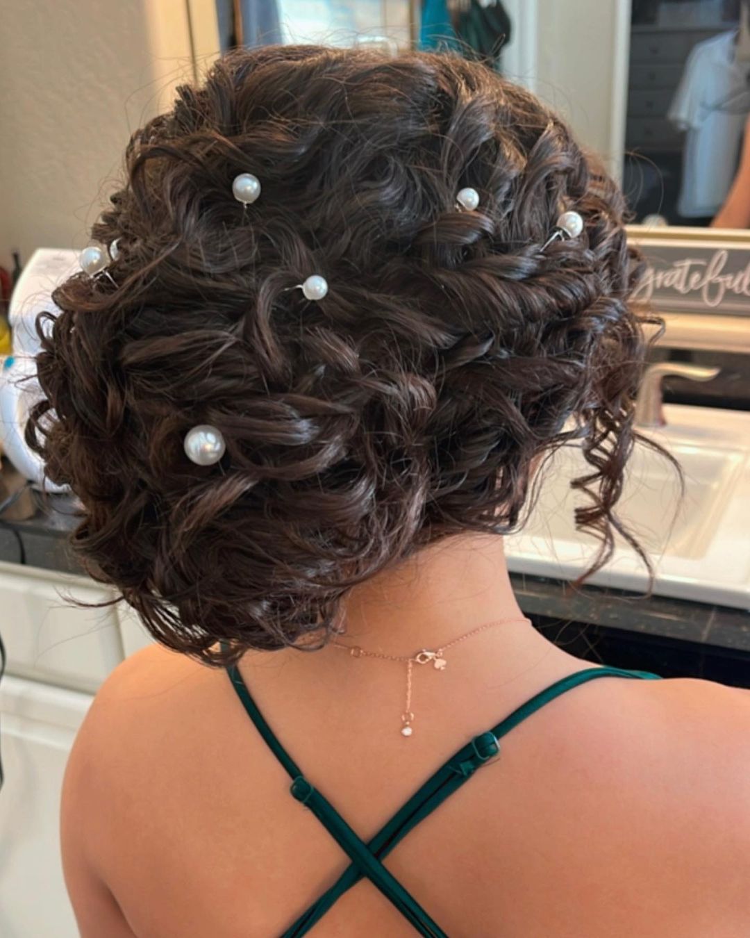 elegant curly updo with pearls