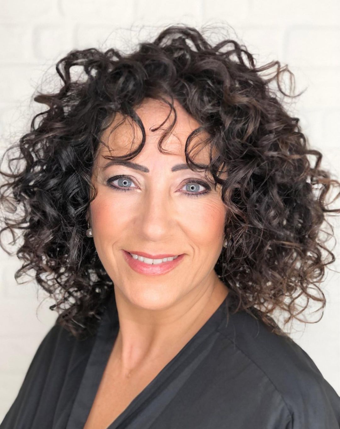 layered curly bob for older women
