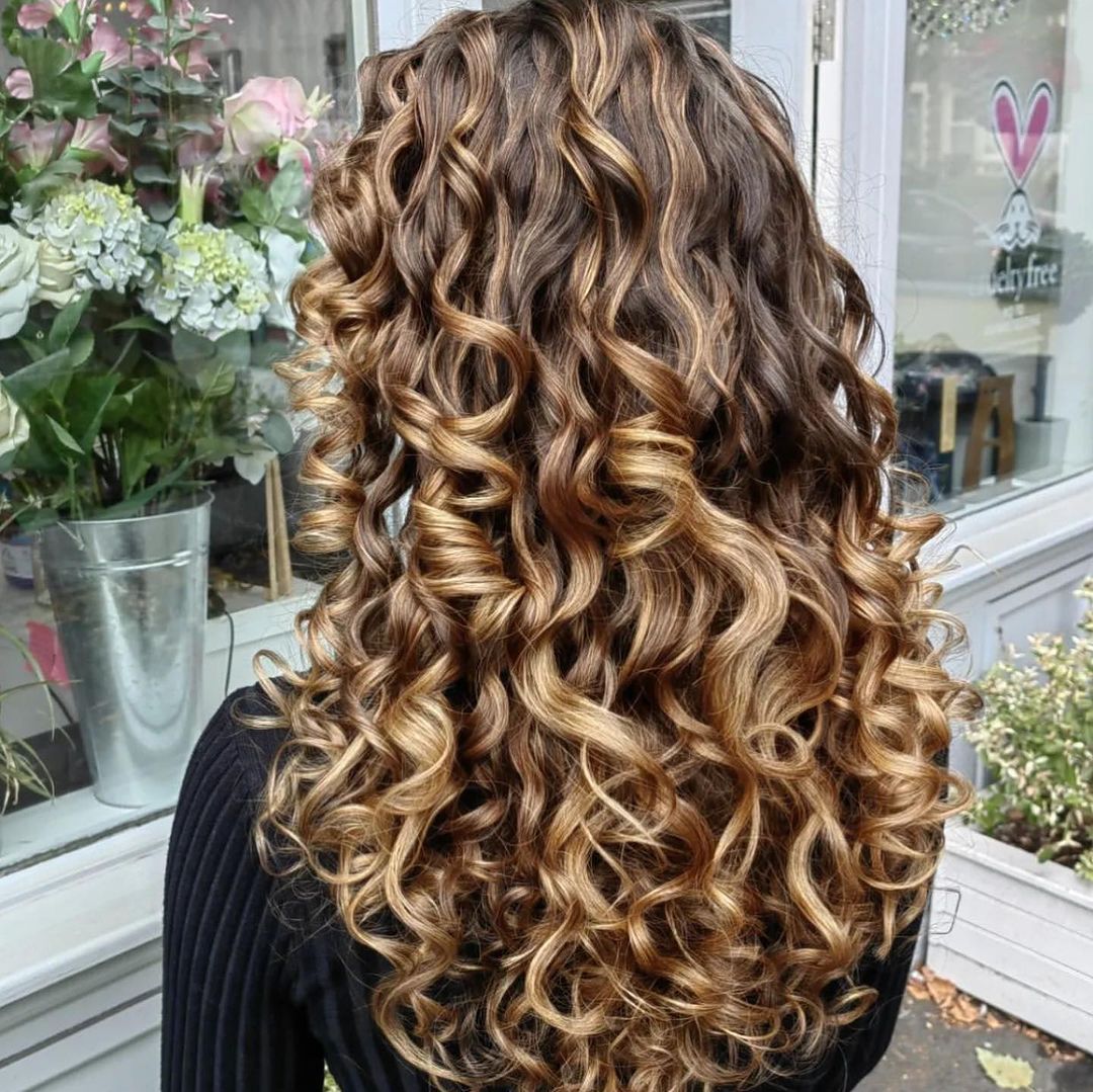 long curly hair with blonde highlights