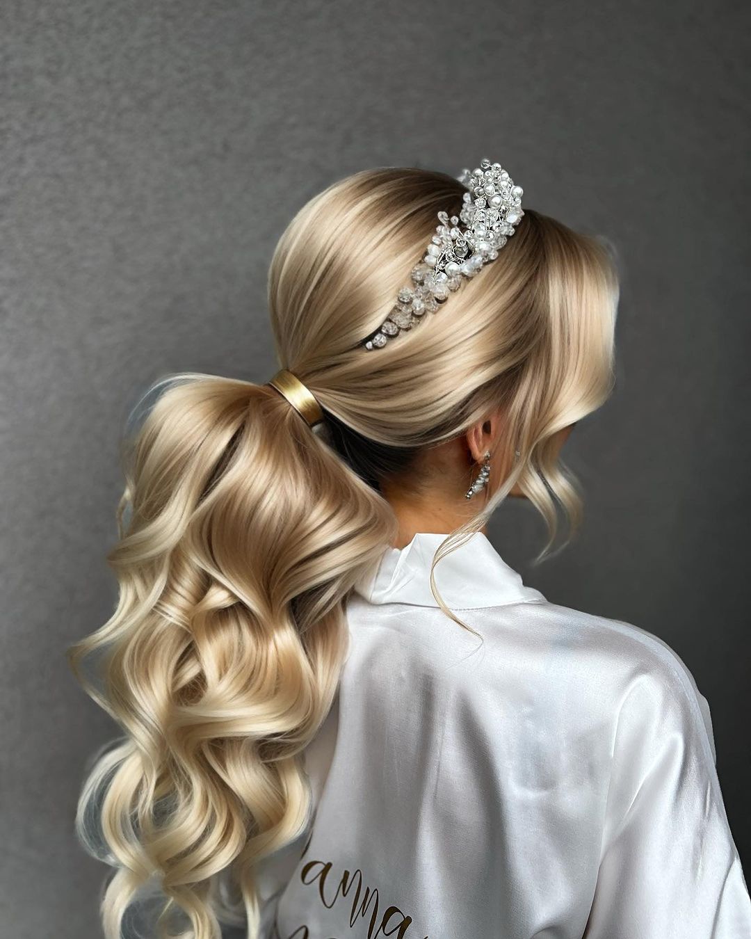 low ponytail and a tiara