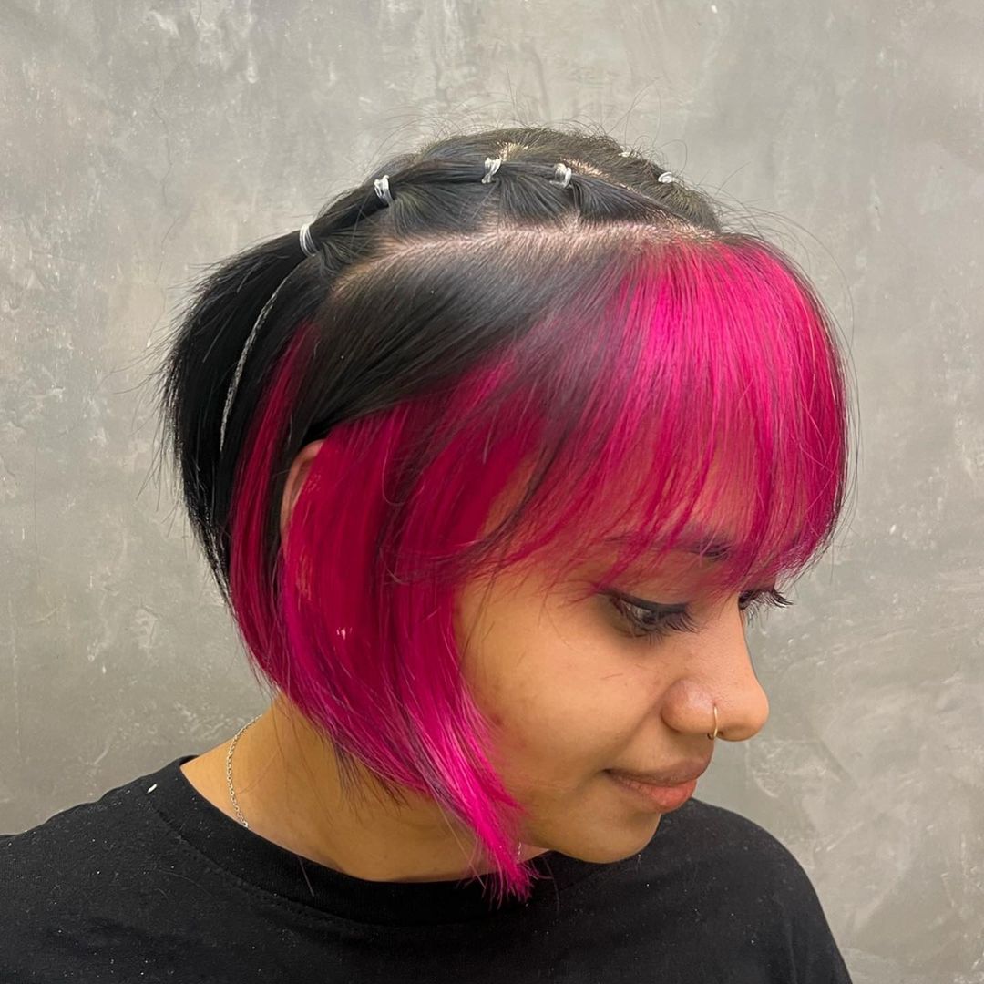 pink bangs and face frames on black bob cut