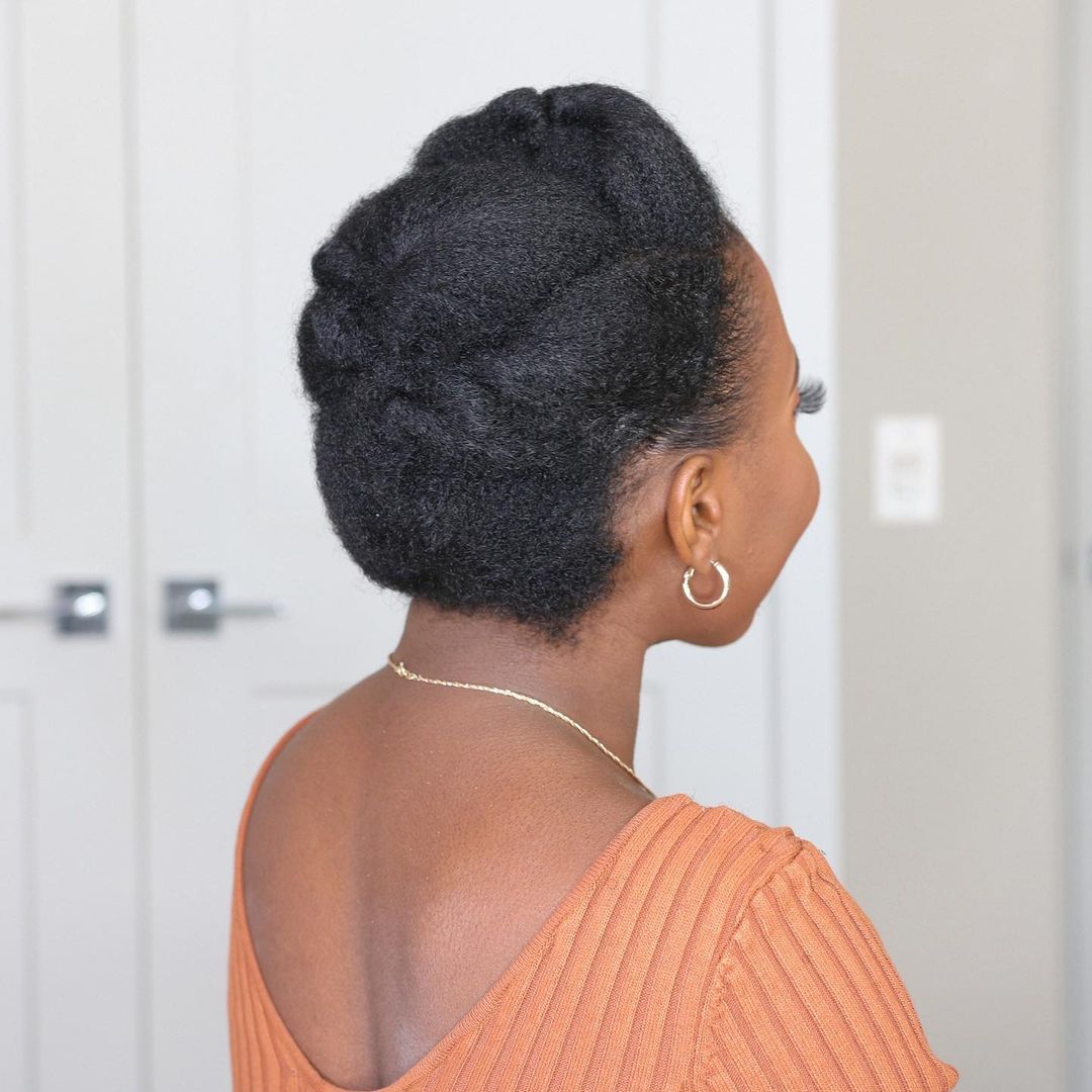 roll and tuck black hairstyle