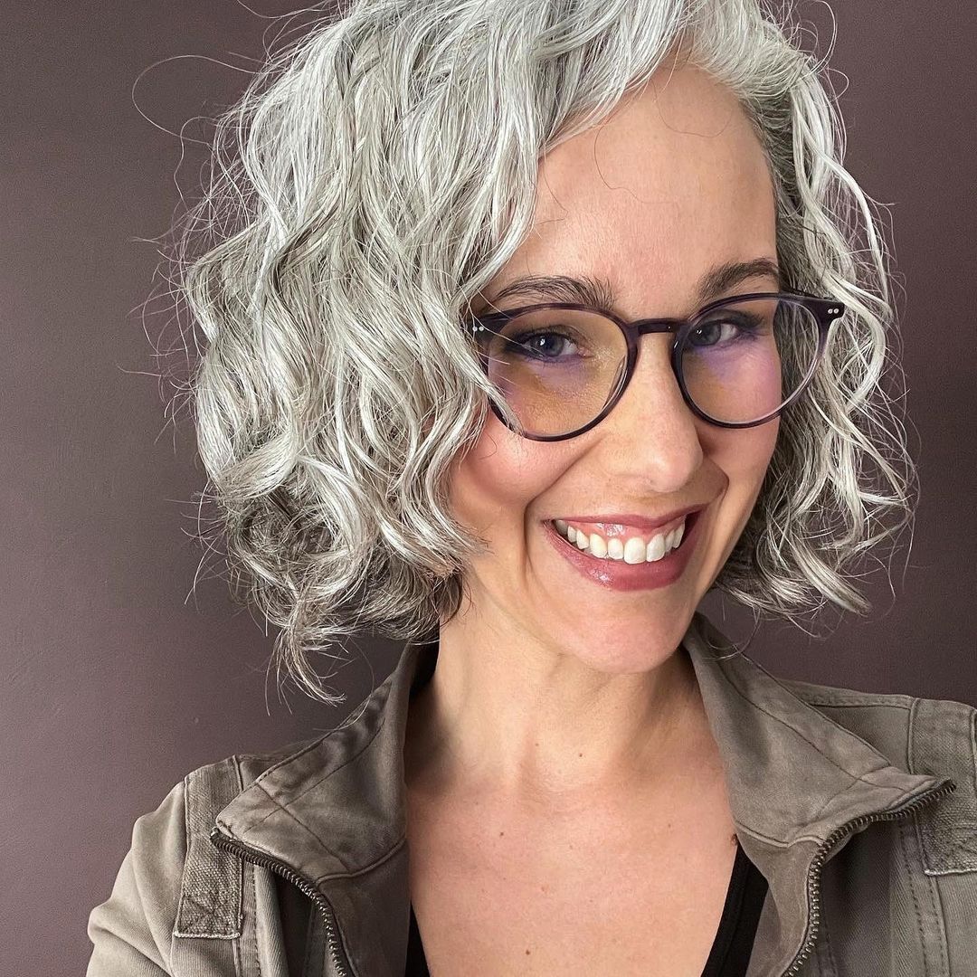 silver blonde side parted curly bob