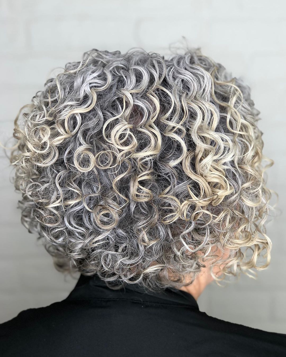 silver blonde stacked curly bob