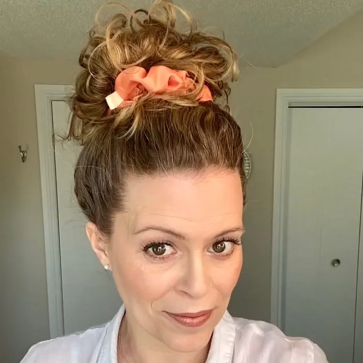 cute updo hairstyle with an extra large scrunchie
