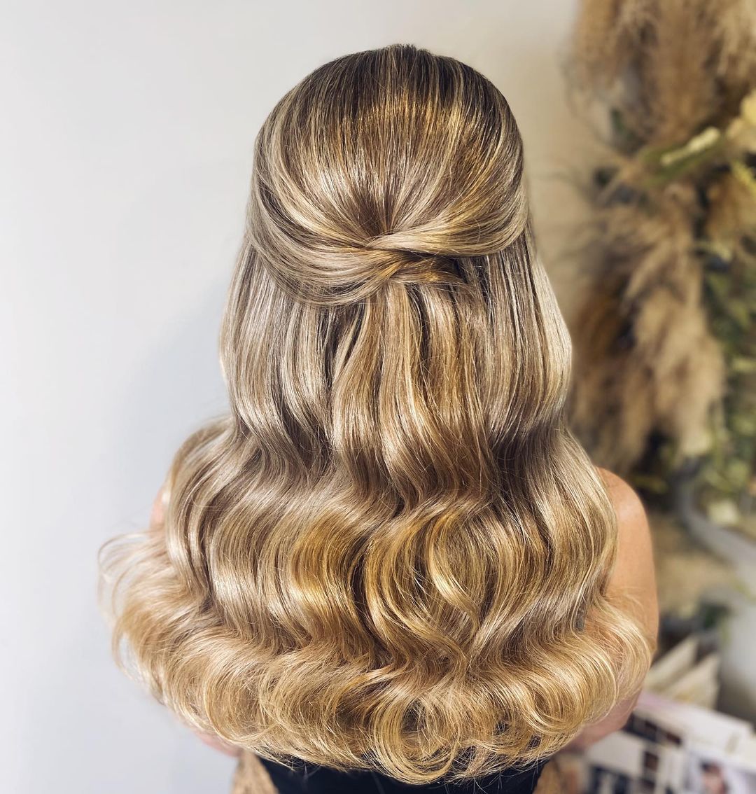 twisted half up half down wavy hairstyle for wedding
