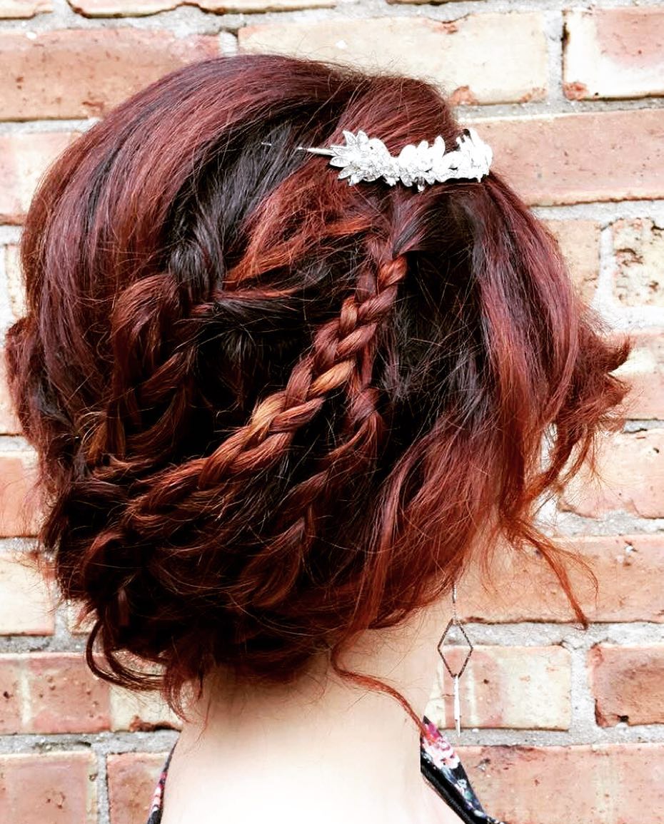 updo with braid and decorative pin