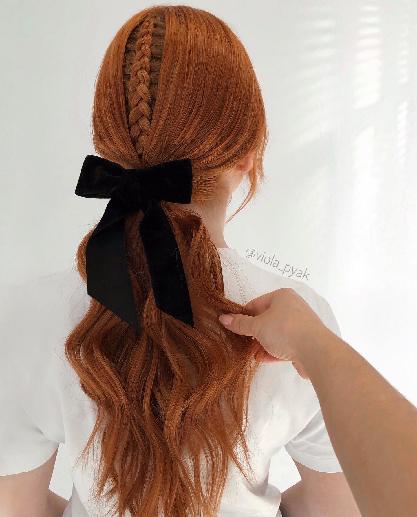 hidden dutch braid into low ponytail