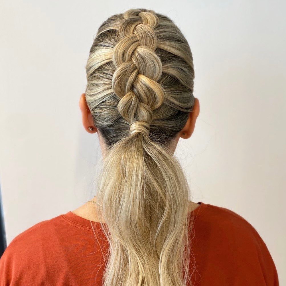 dutch braid into low ponytail