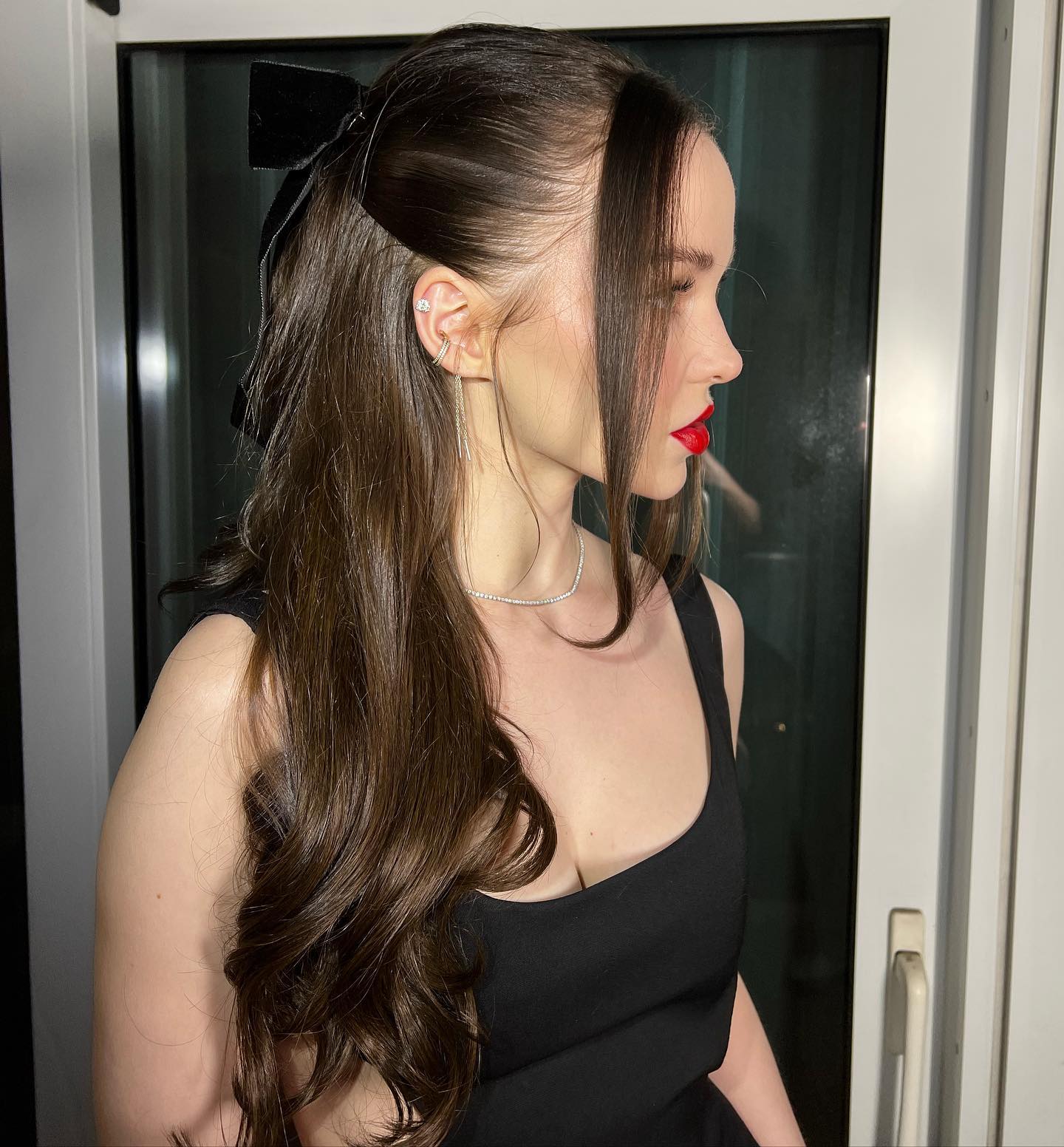 sleek half ponytail with long bangs