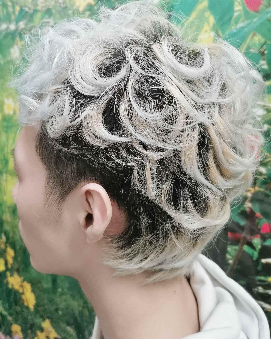 black and white curly pixie cut