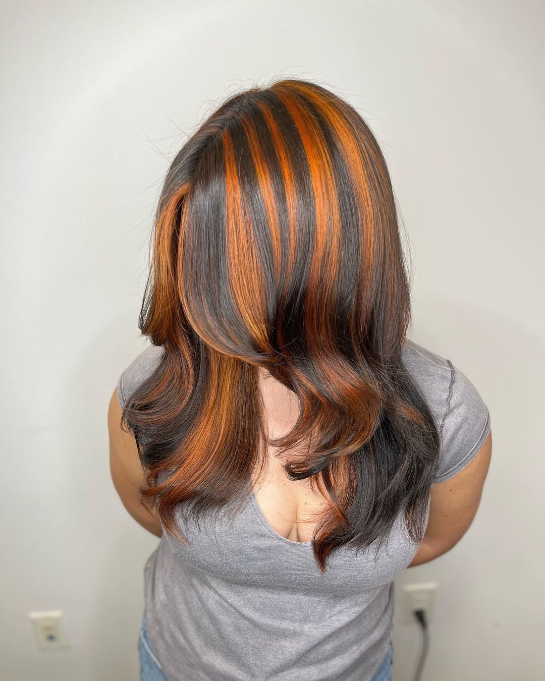 black hair with chunky ginger highlights