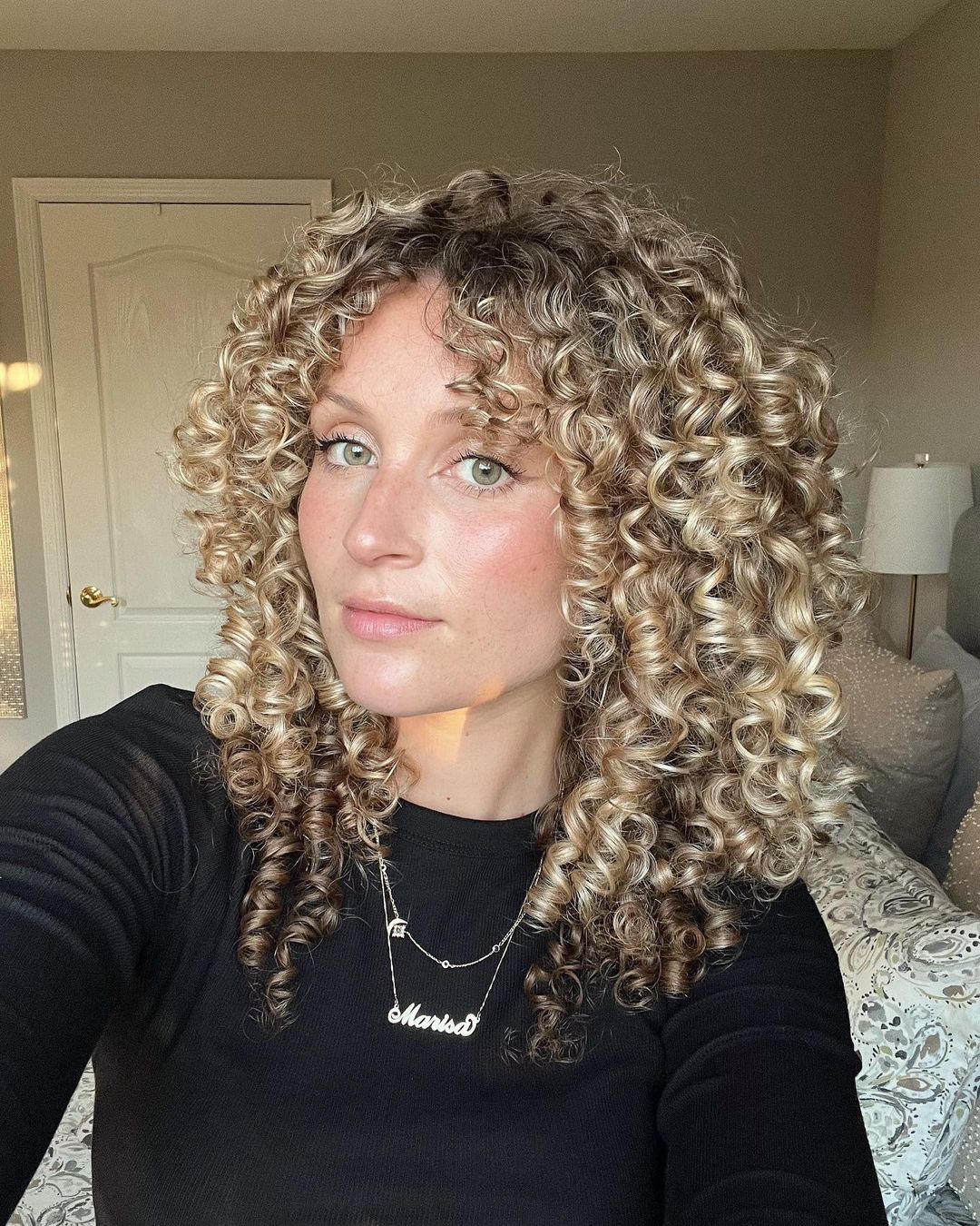 Blonde Ringlet Curls With Curtain Bangs