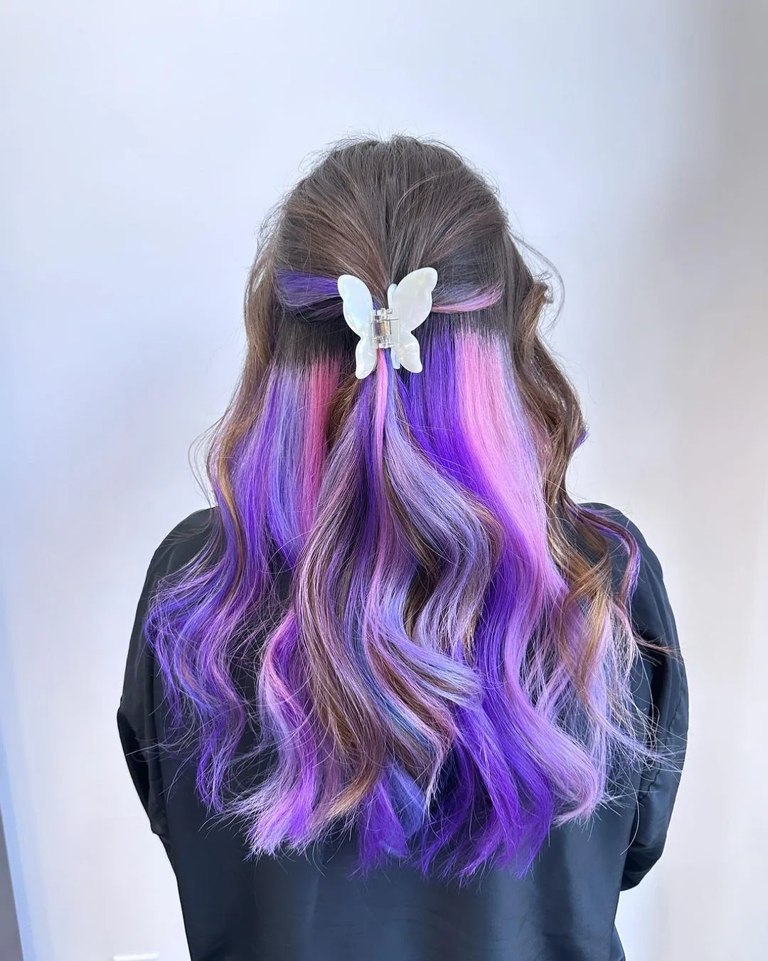 pastel hair with a butterfly hair clip