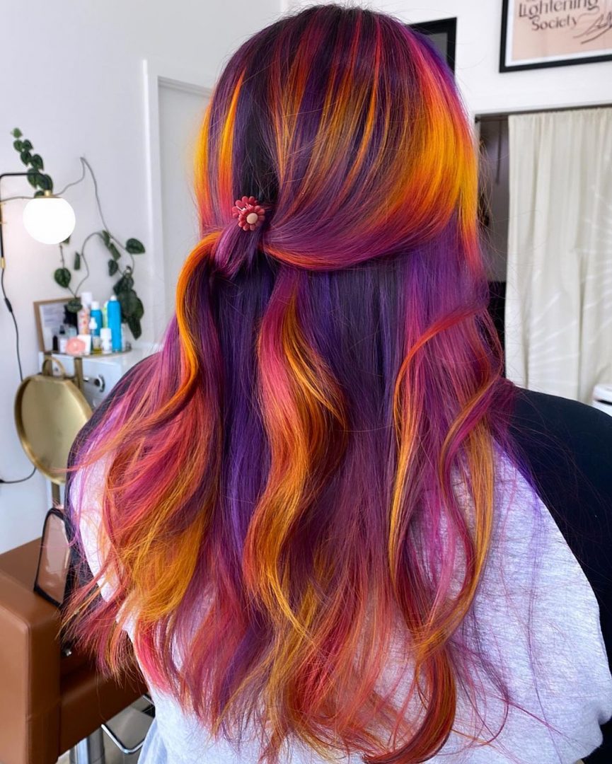 Long, layered waves showcasing metallic hair