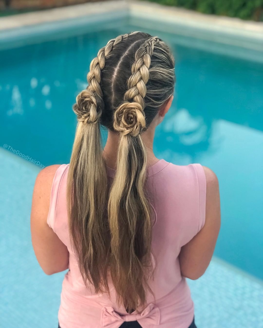 Double Dutch braid pigtails with roses