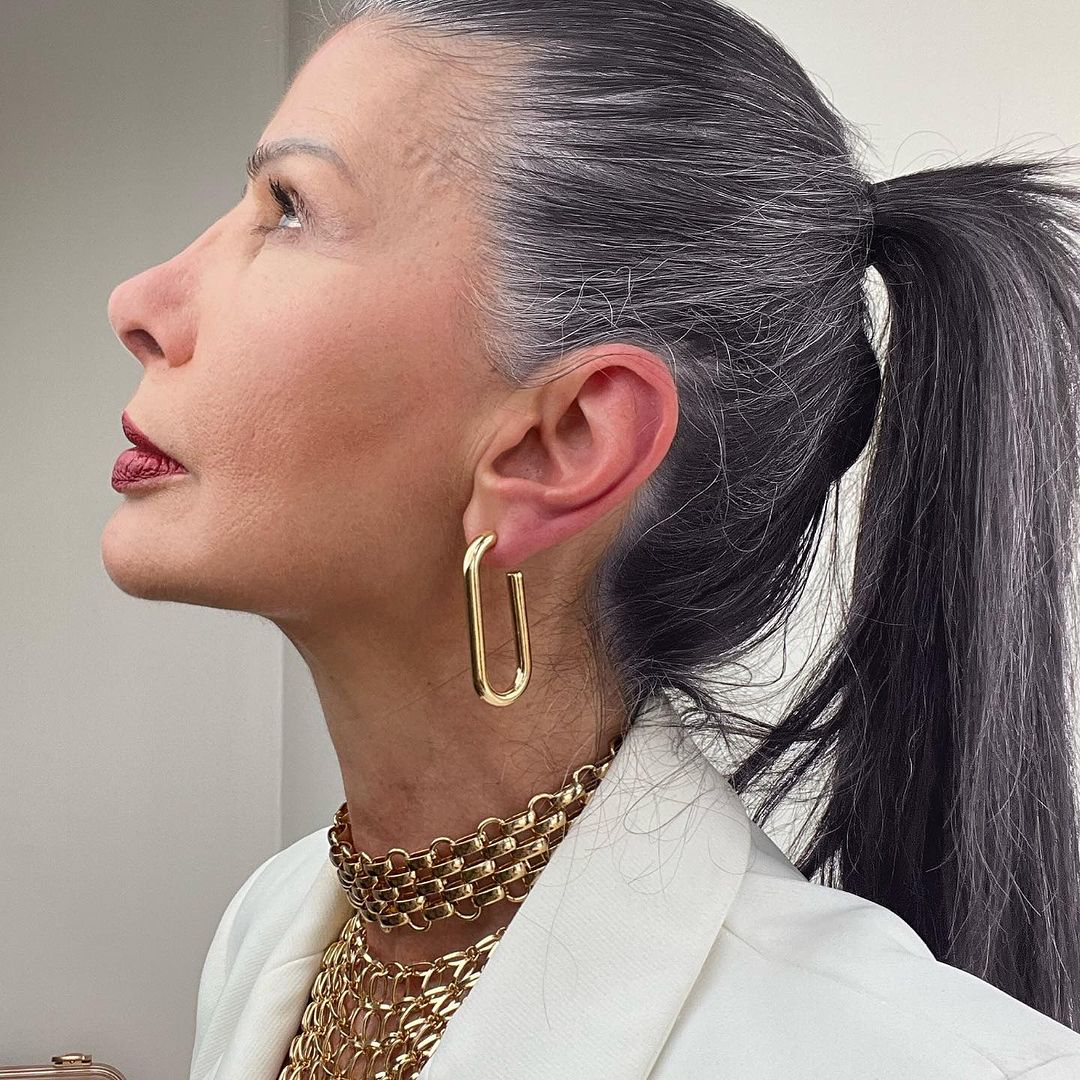 woman over 50 with a high ponytail