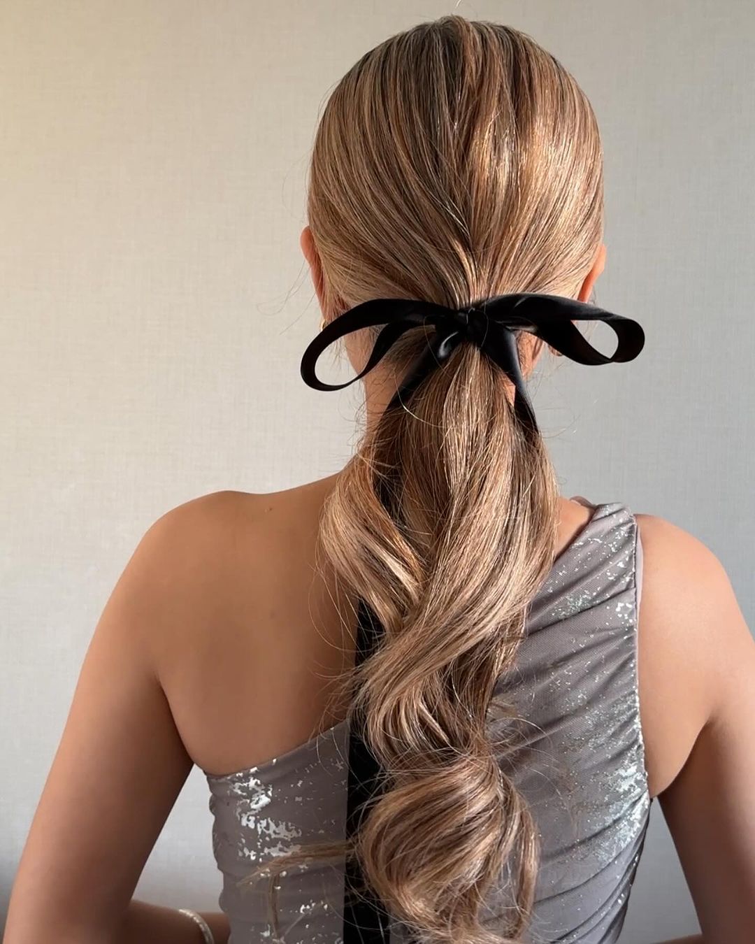 low ponytail with a ribbon