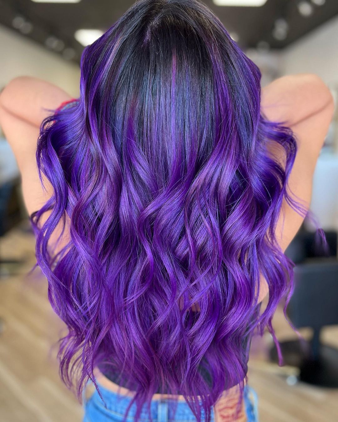 purple balayage on dark brown wavy hair