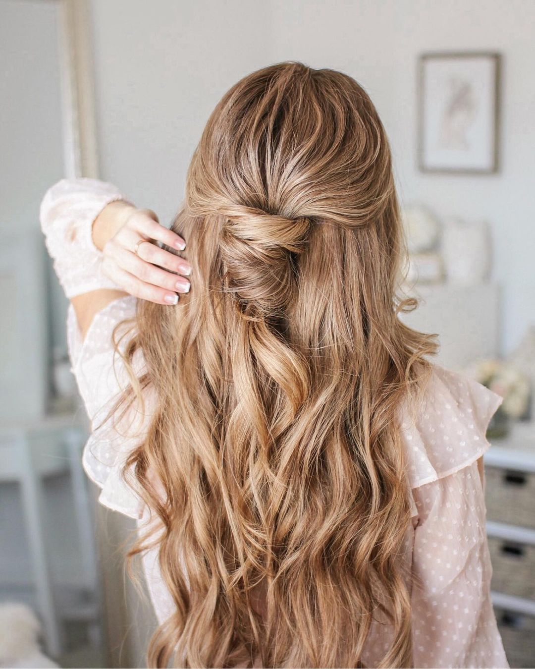twisted half up long wavy hairstyle