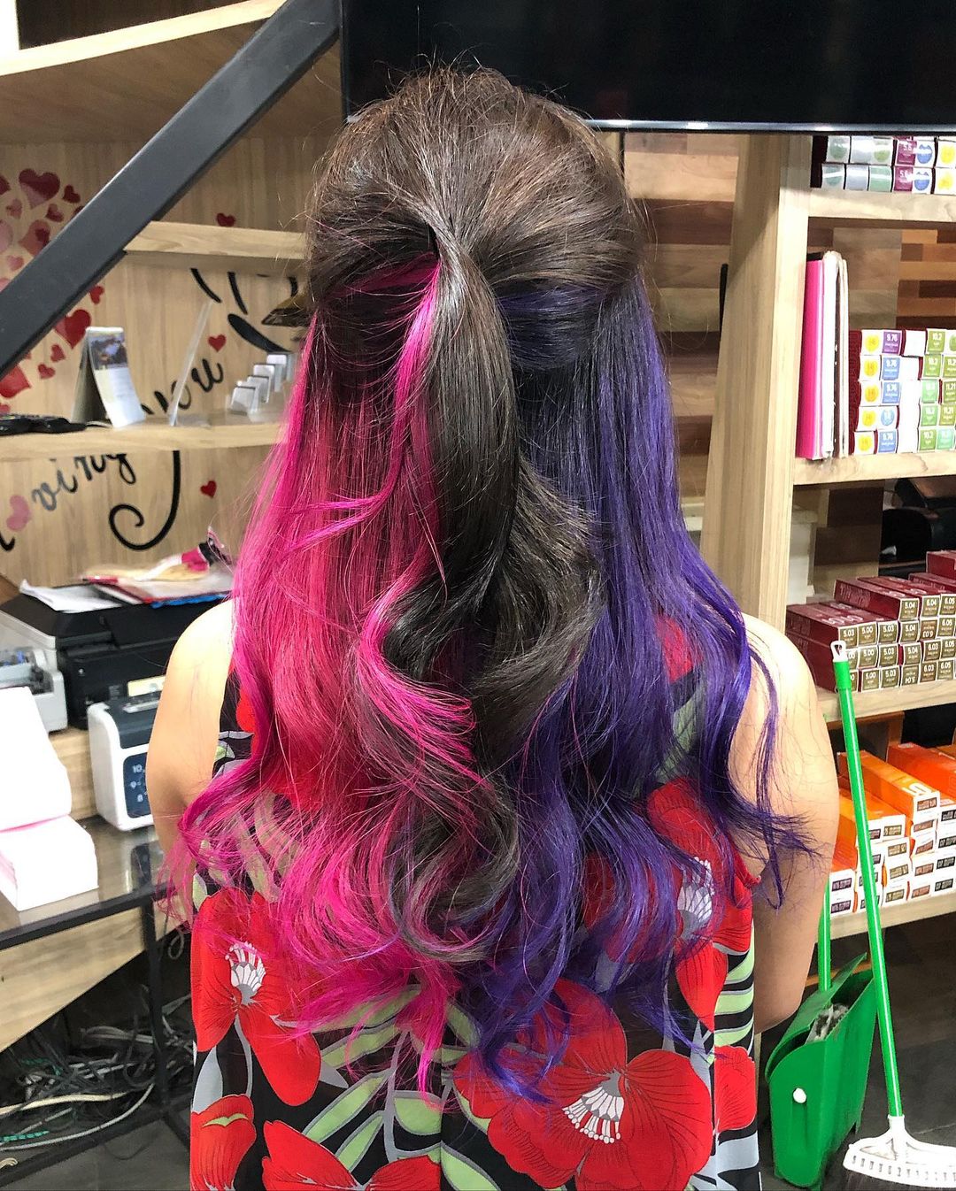 violet and pink peekaboo on black hair