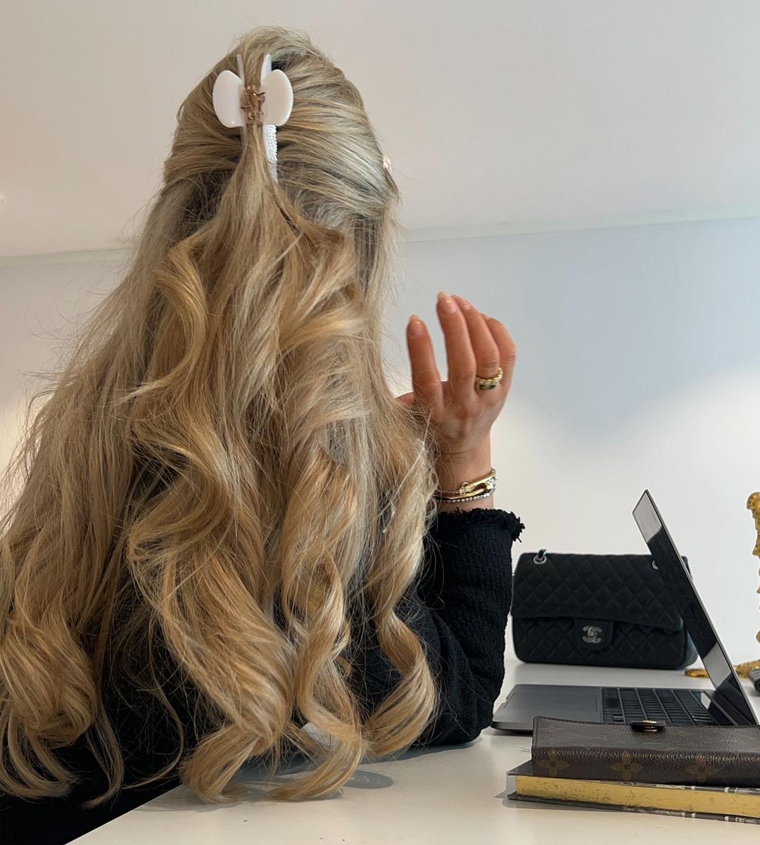 long blonde wavy hair with a claw clip