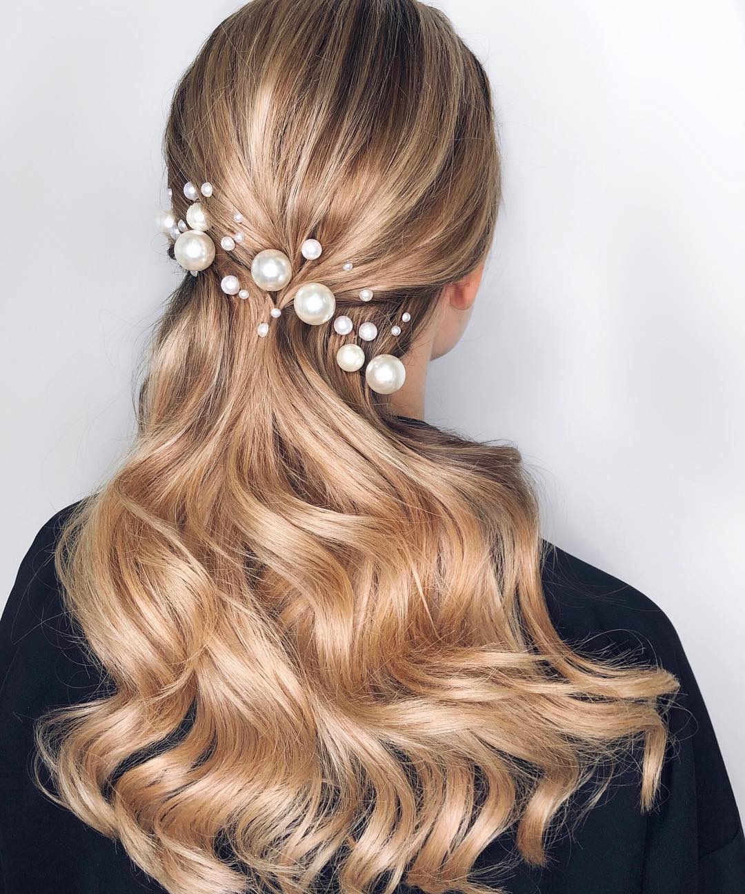 low half-ponytail with pearls