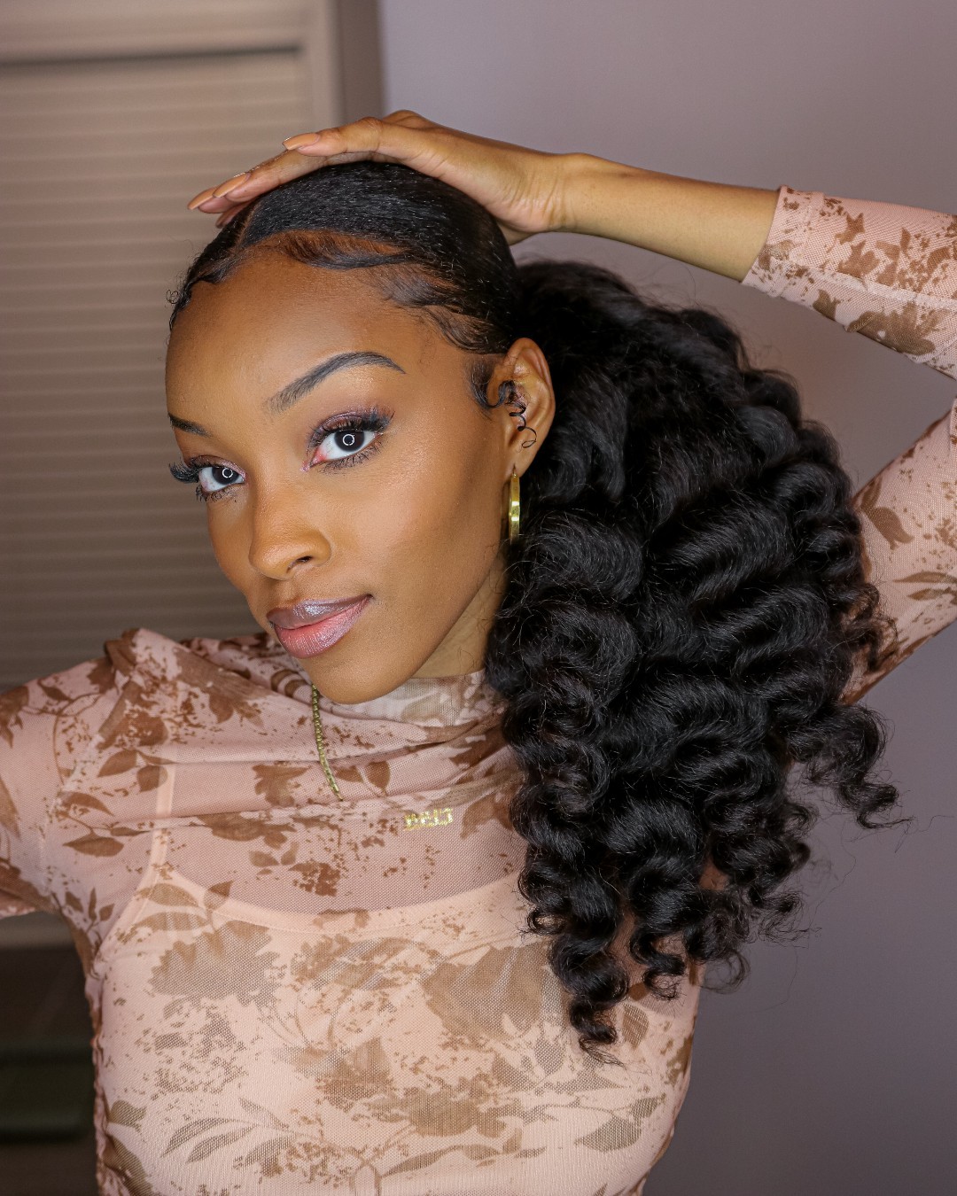 mid-height curly side ponytail