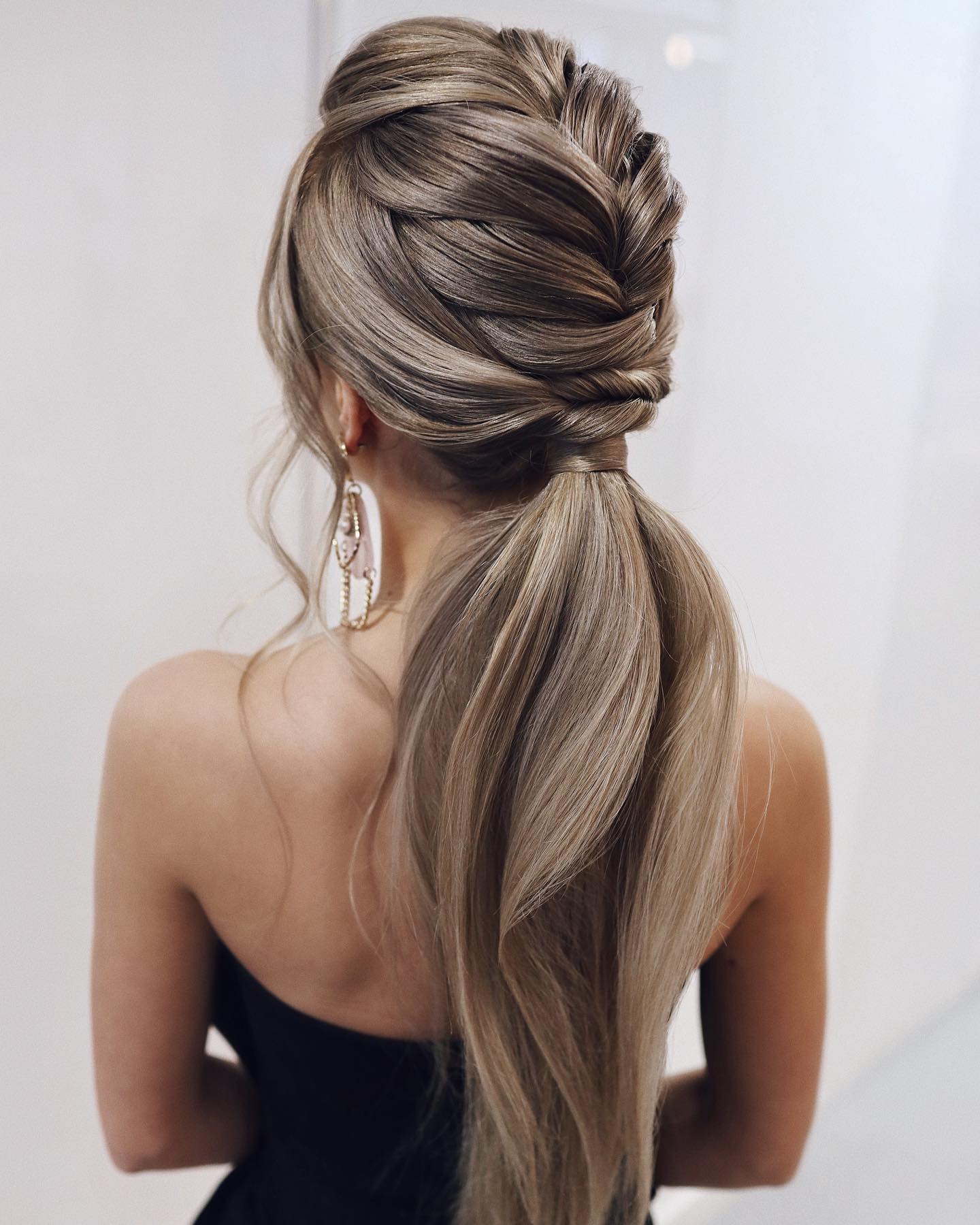 braid into low ponytail prom hairstyle
