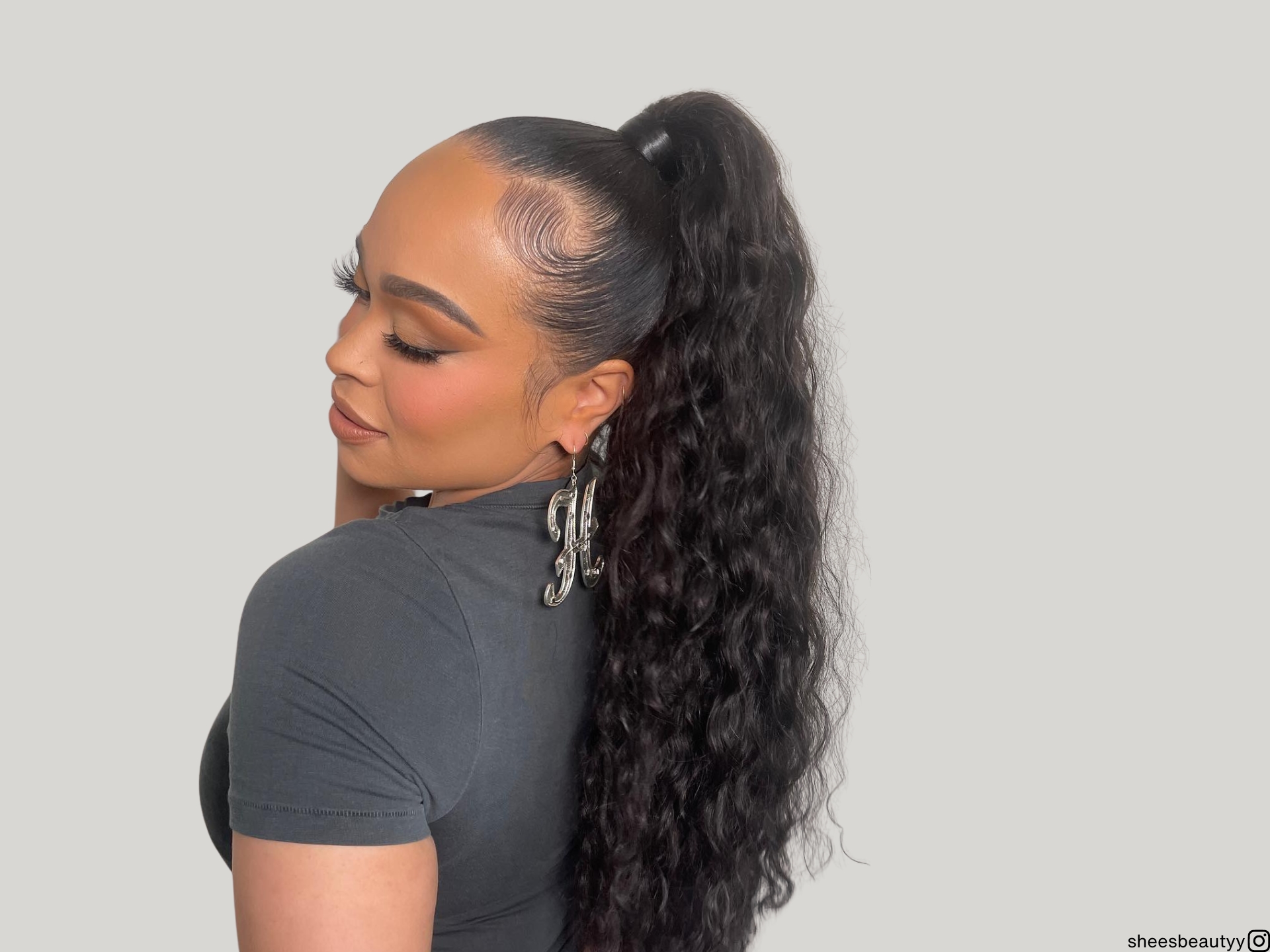 high curly ponytail weave