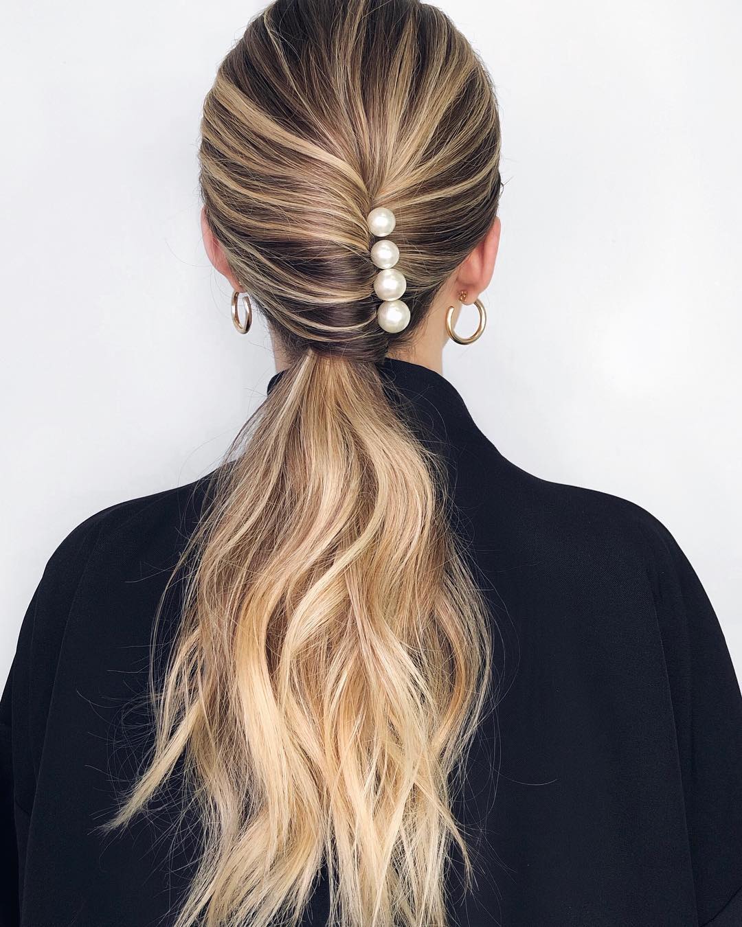 chignon low pony with pearl pin