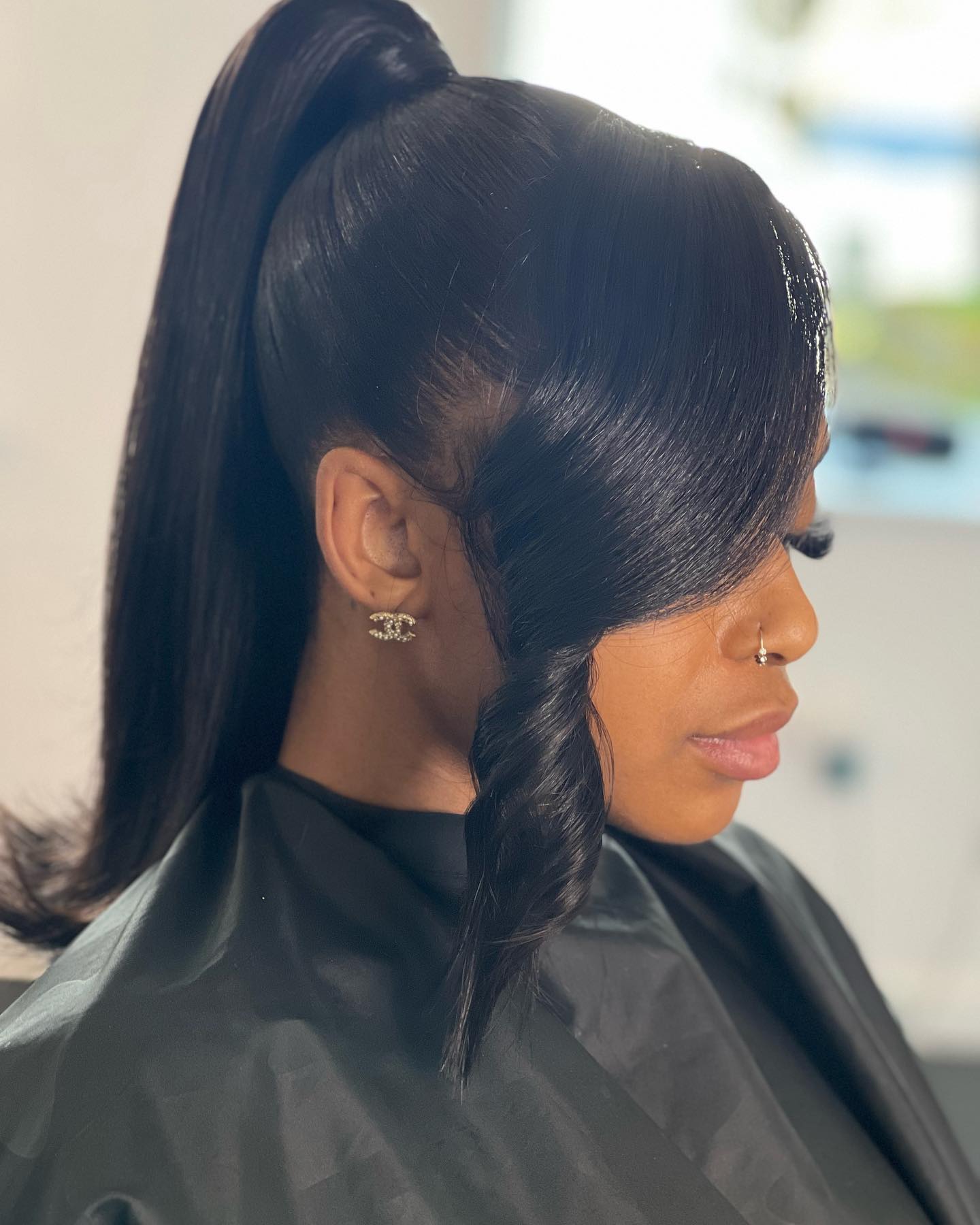 high ponytail with swoop and side bangs