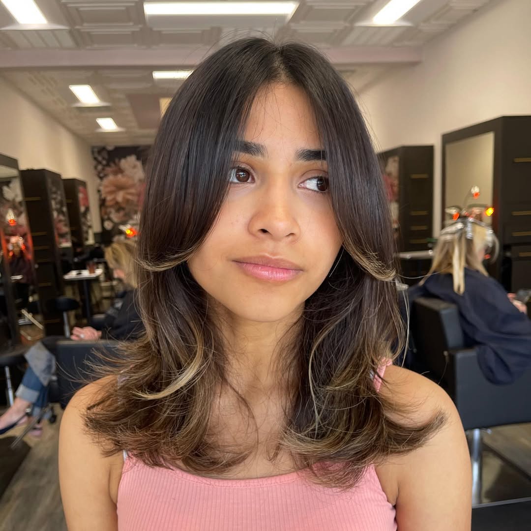 medium layered hair with curtain bangs