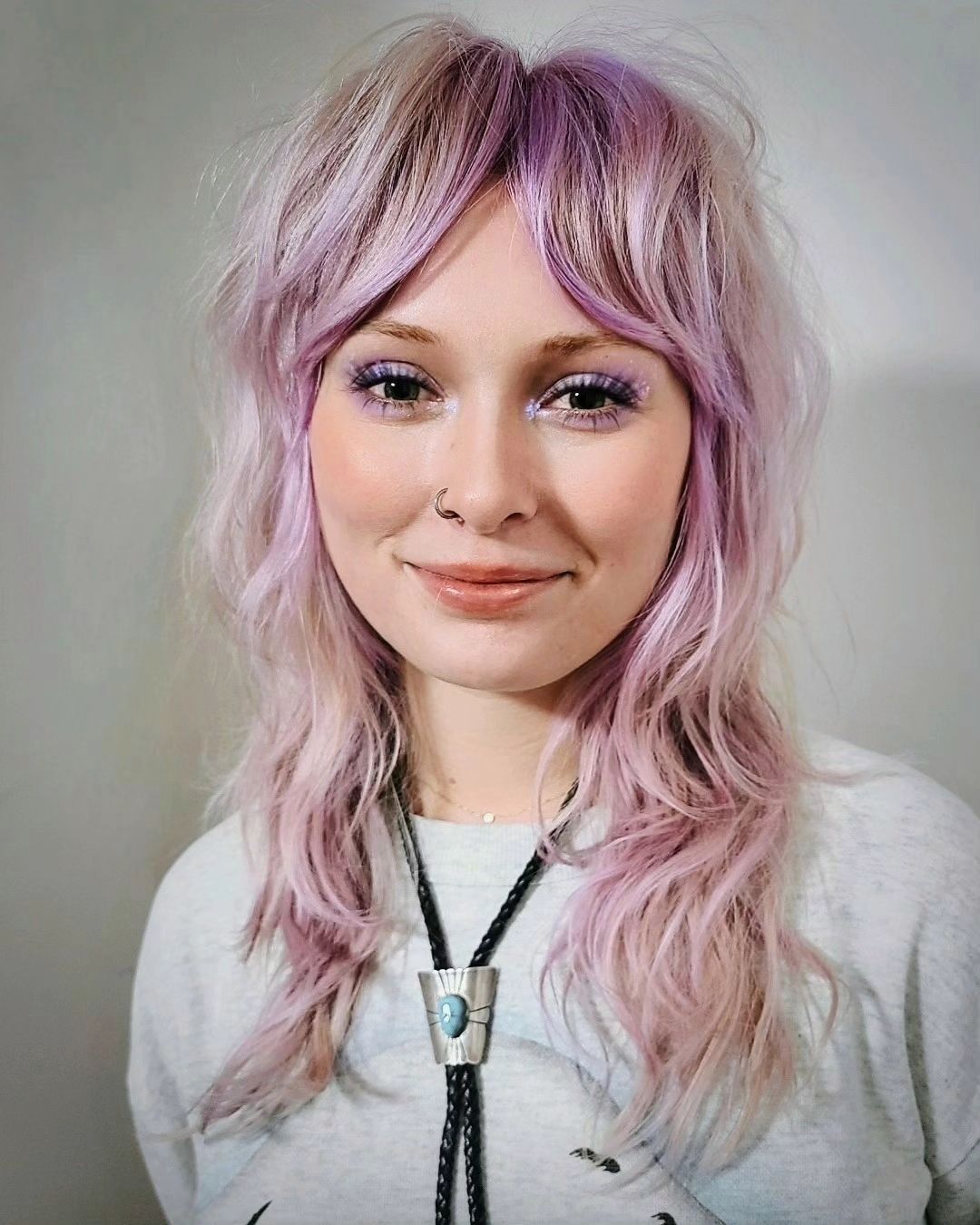 pastel pink wavy shag with arched bangs