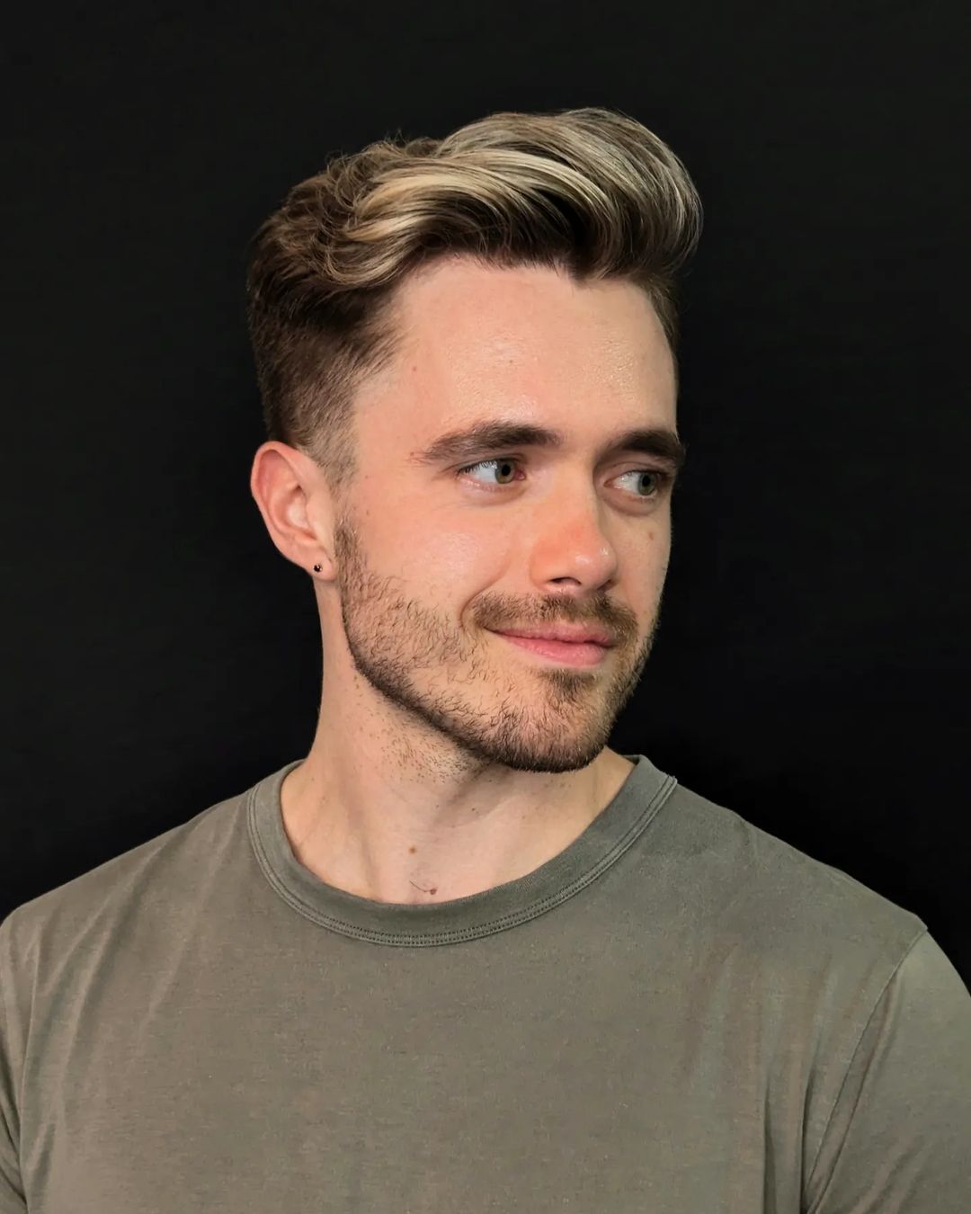 a man with pompadour fade haircut