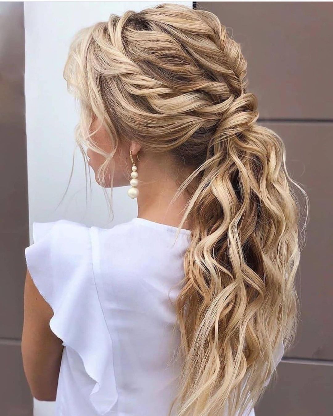 twisted hair and low wavy ponytail 