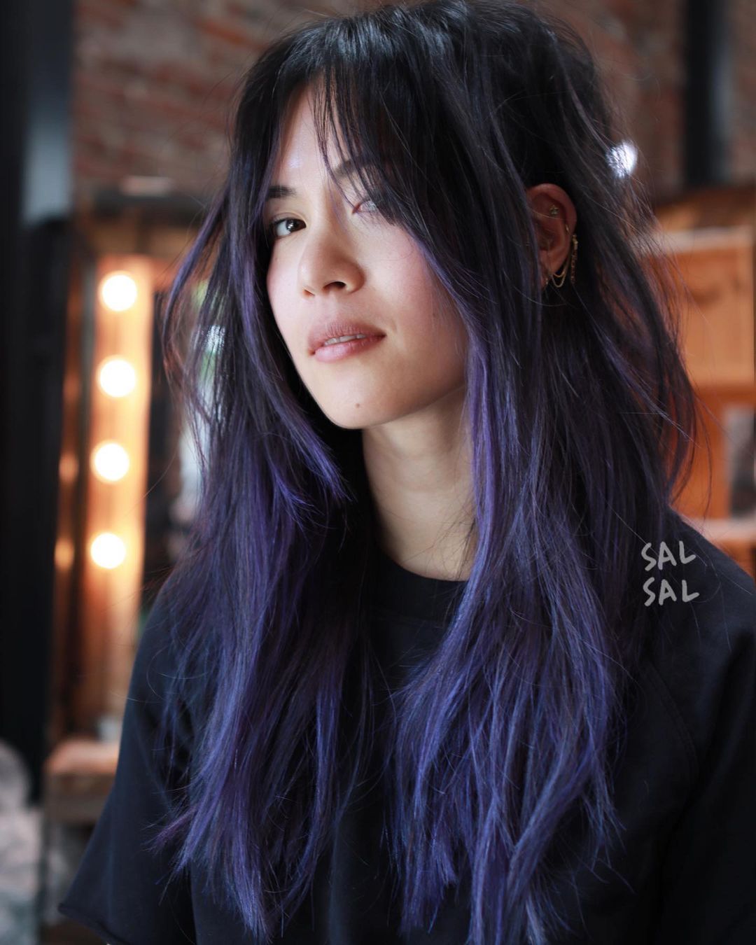 wolf cut with pastel purple highlights