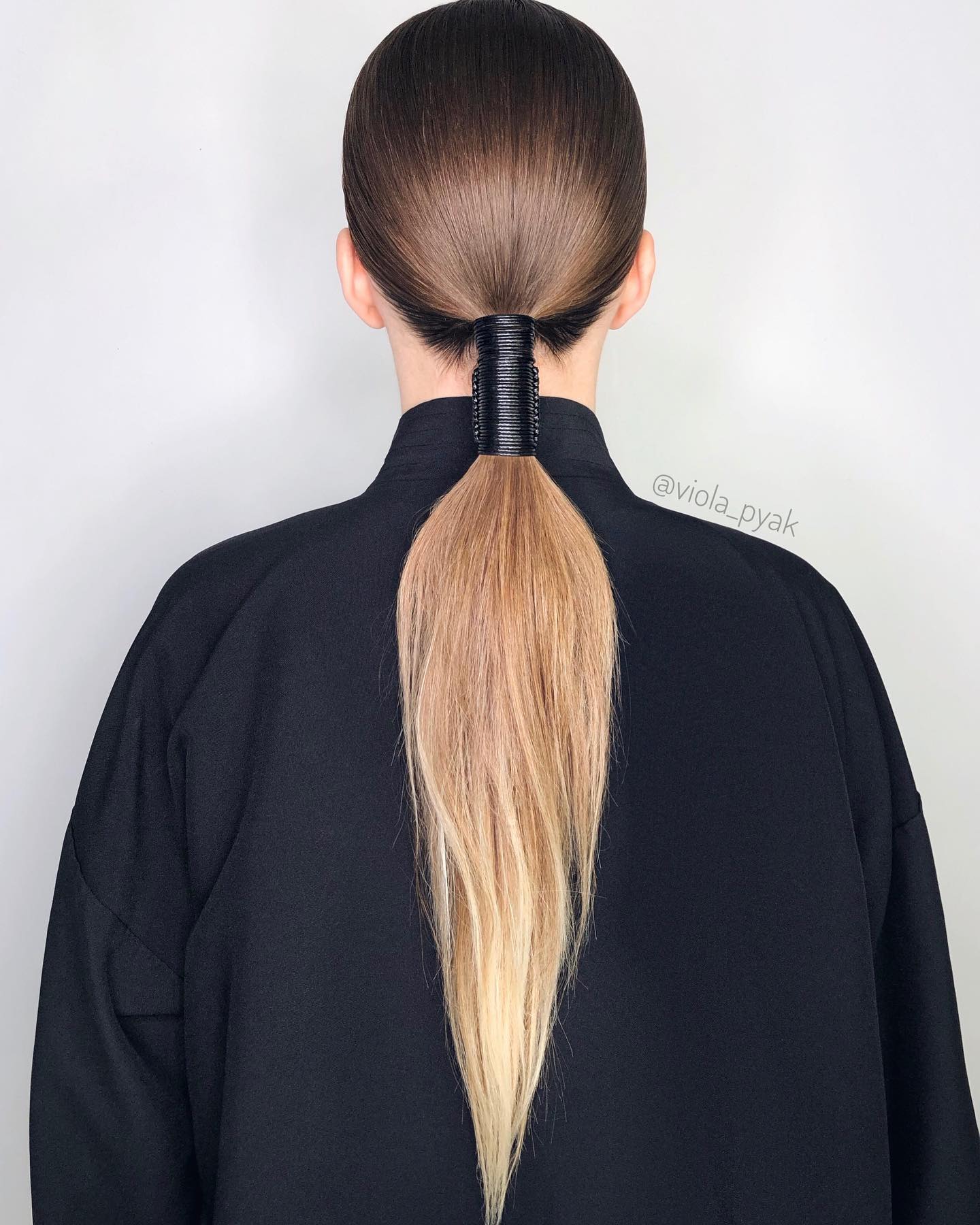 low straight ponytail with accessory
