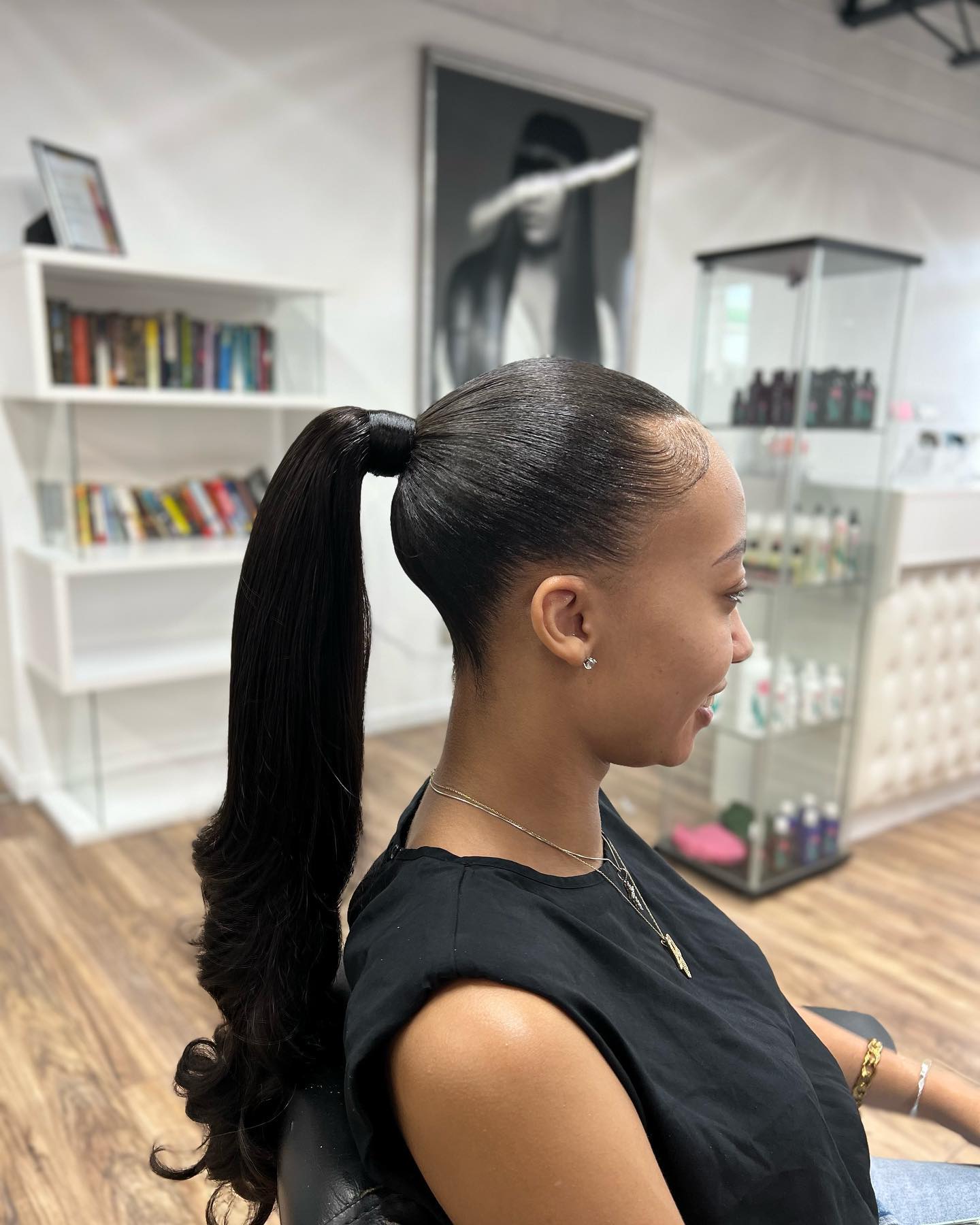 slick-back ponytail with curled ends