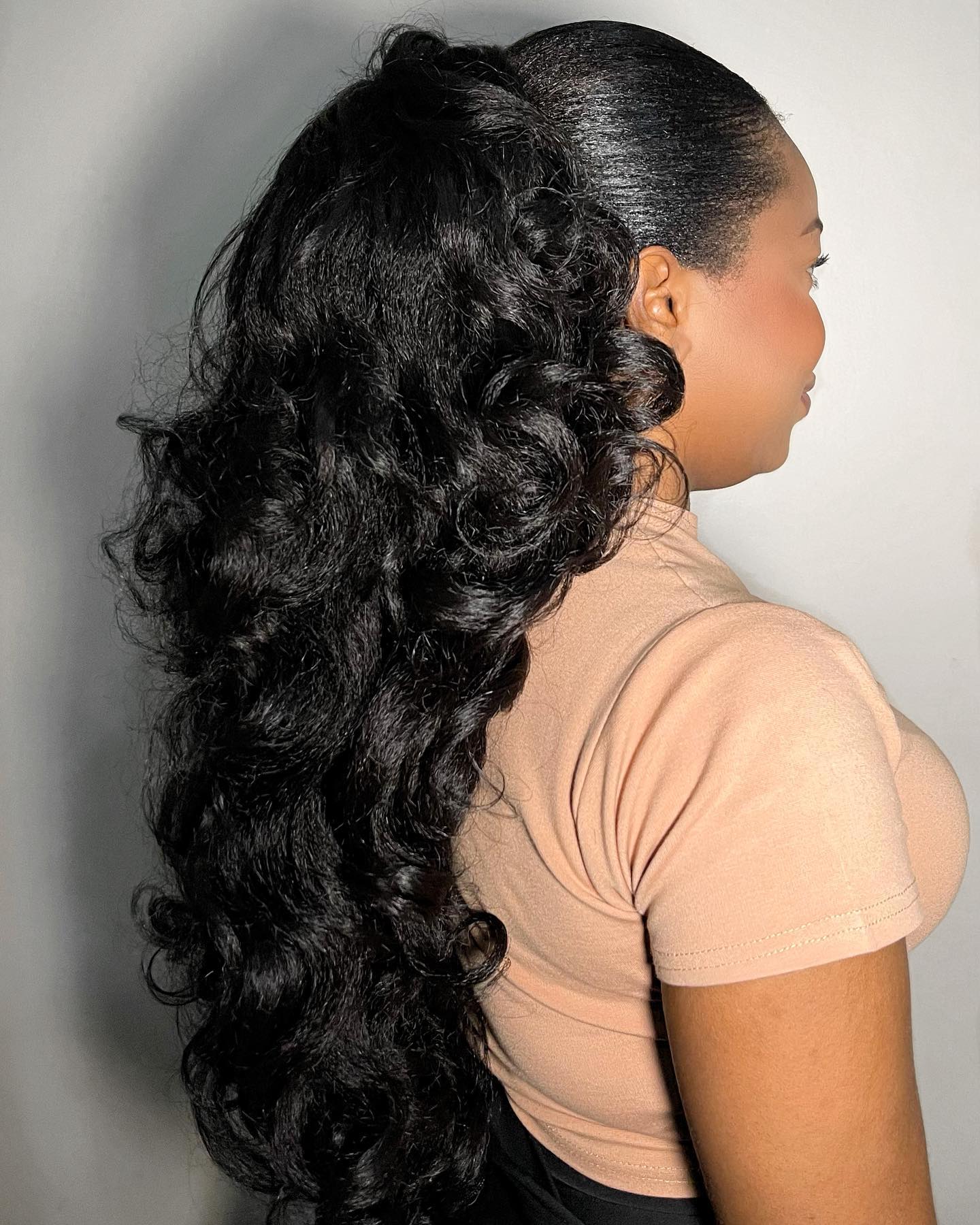 curled ponytail with with weave