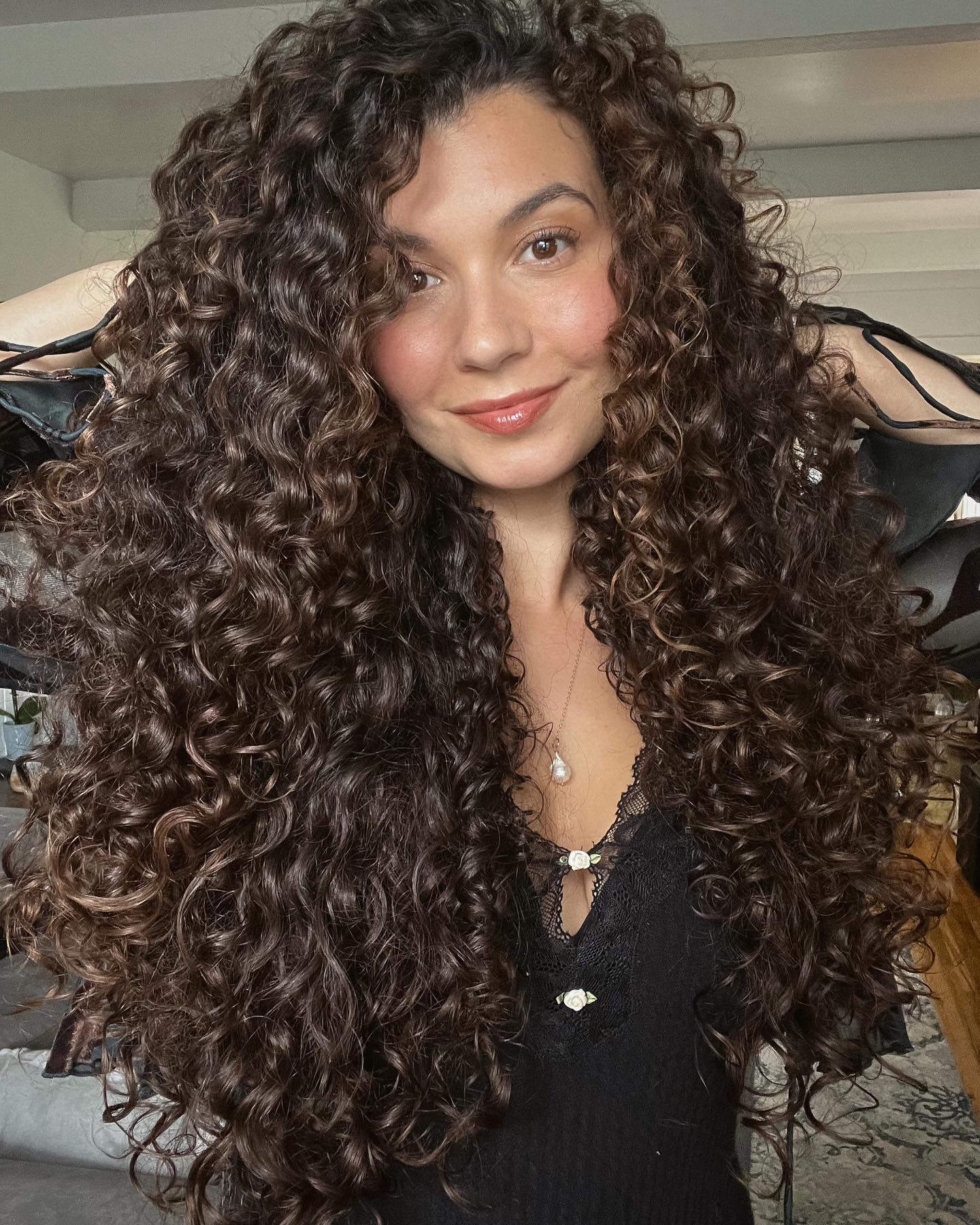 long curly hair with face framing