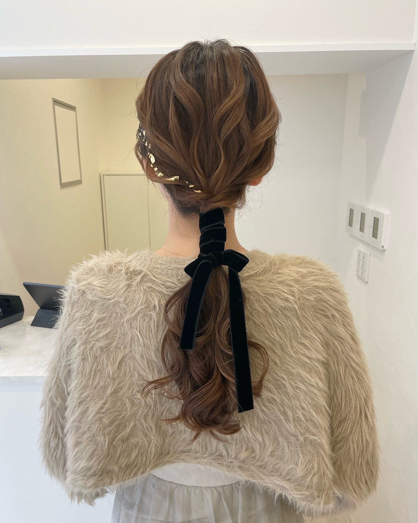 low curled ponytail with ribbon