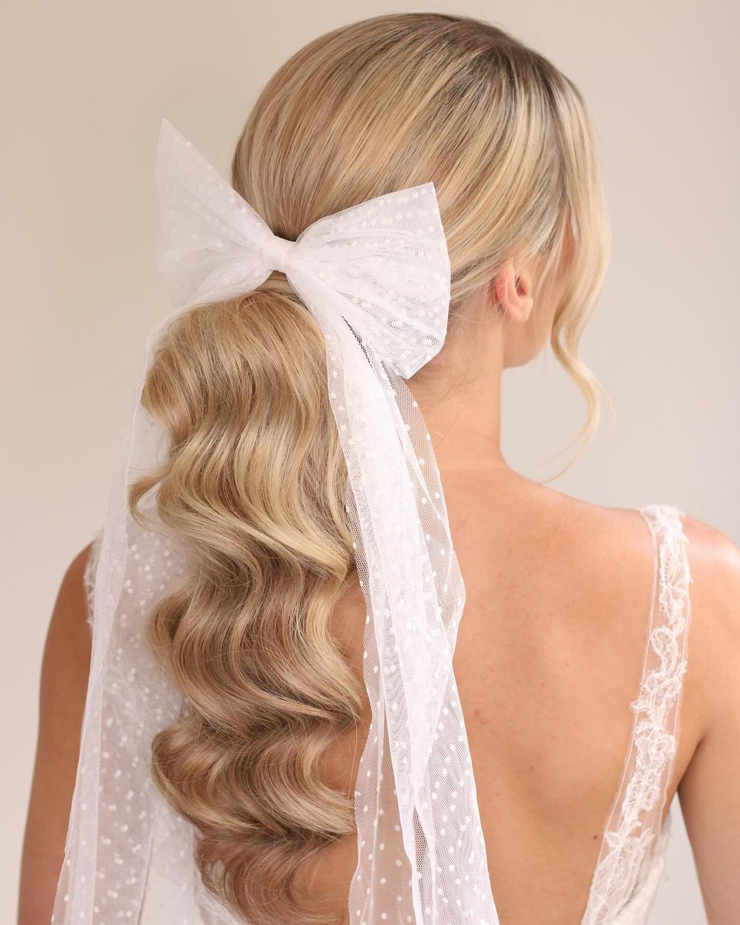 ponytail with a white bow