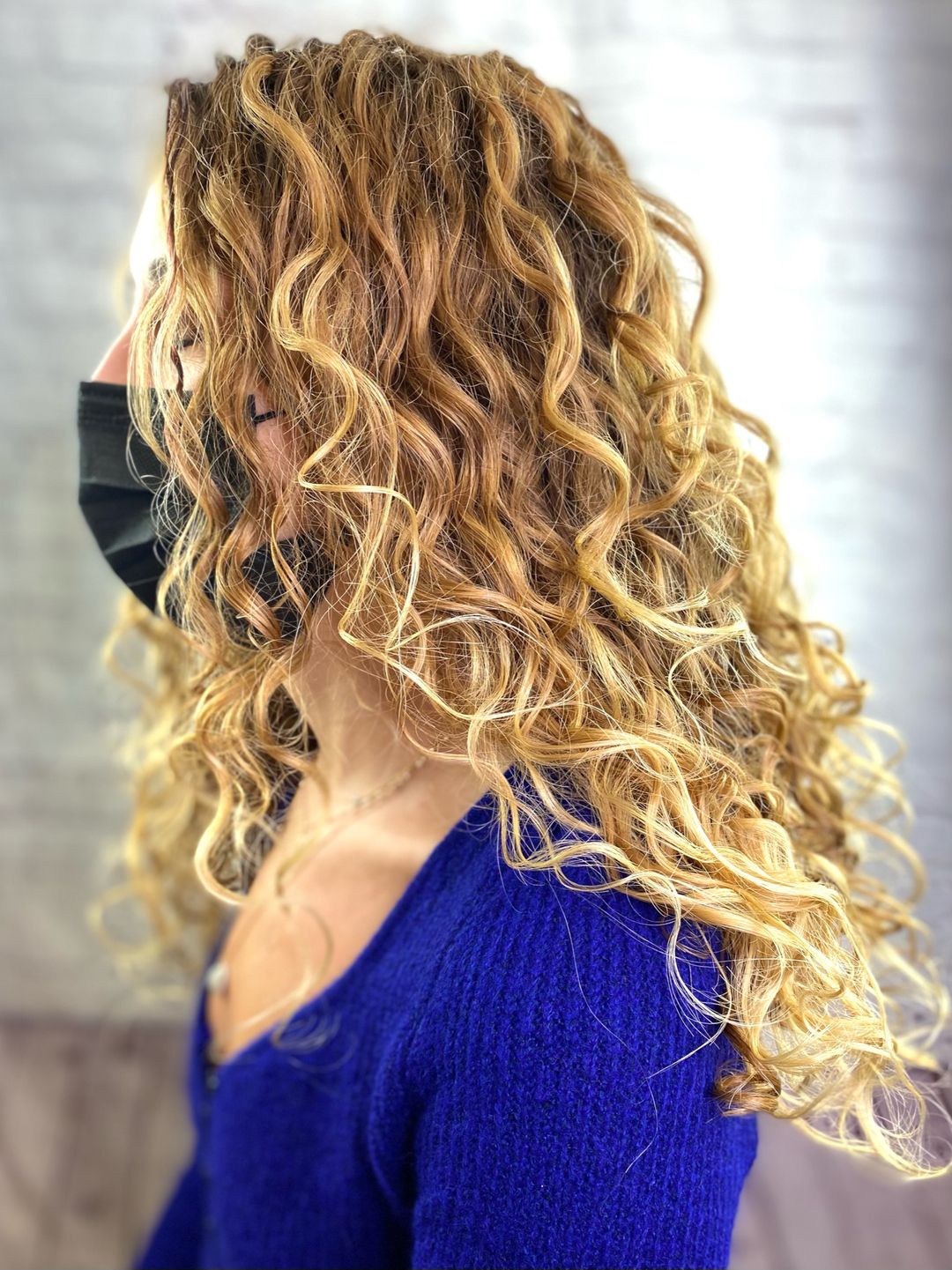 blonde waterfall layered curly hair