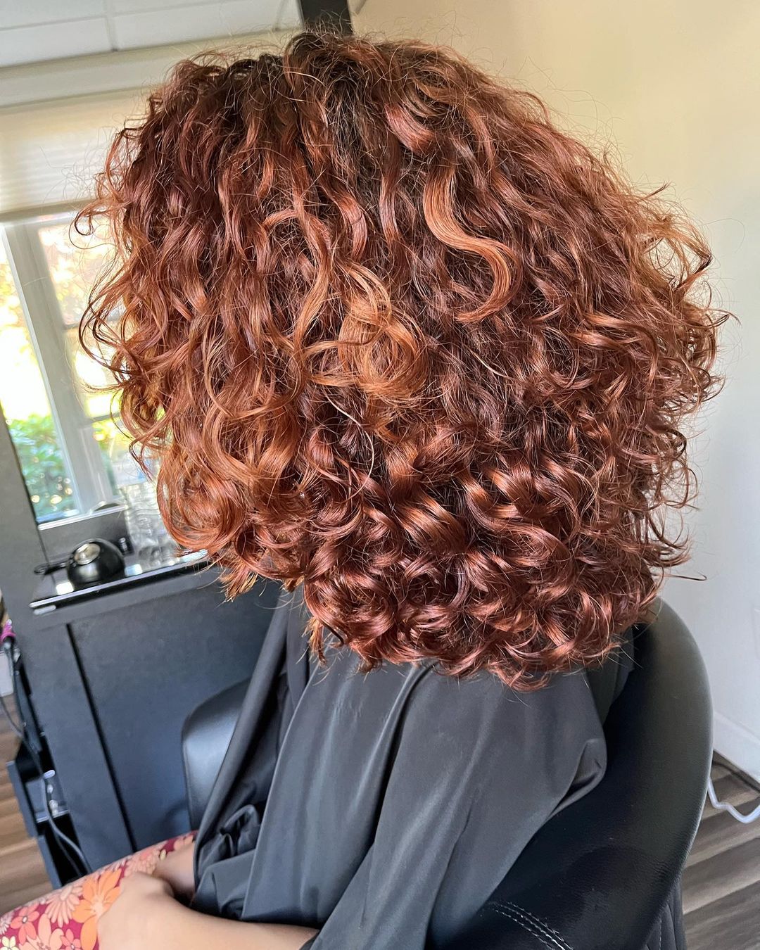 copper brown layered curly hair
