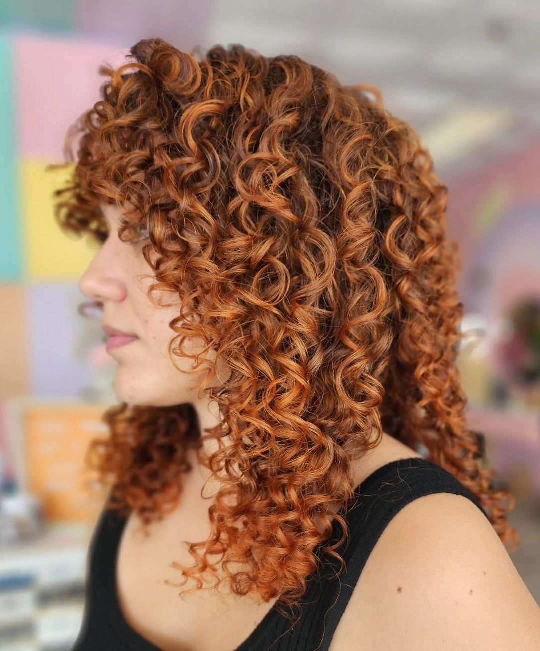 curly hair with bangs and shaggy layers