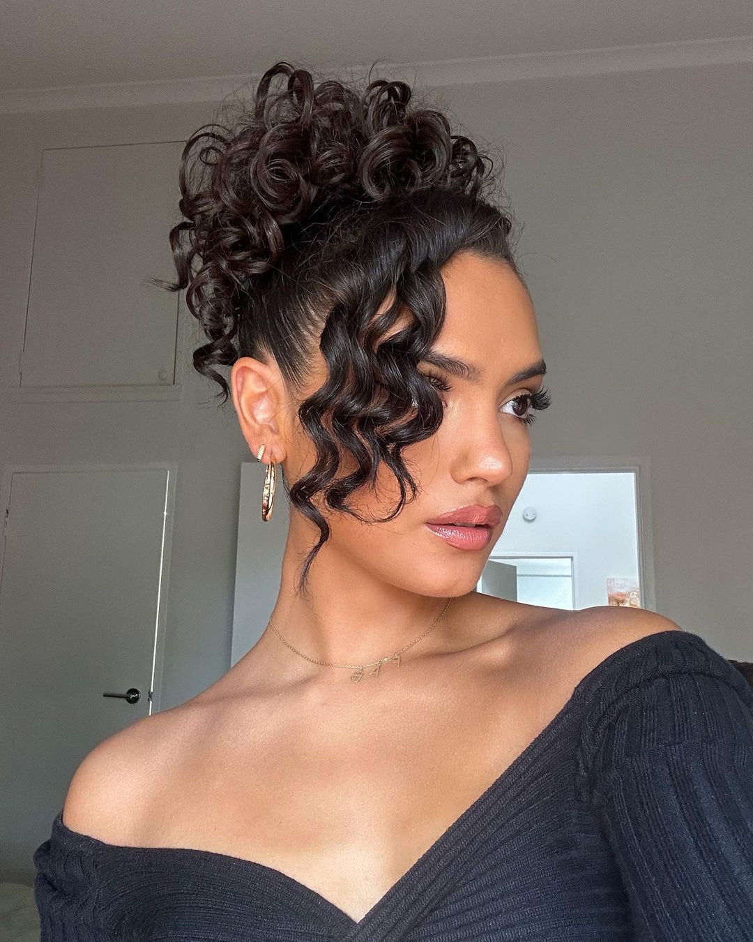 curly updo with side fringe