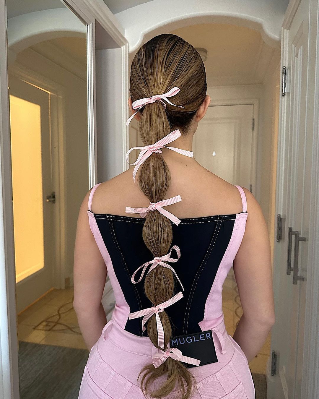 ponytail with pink ribbons